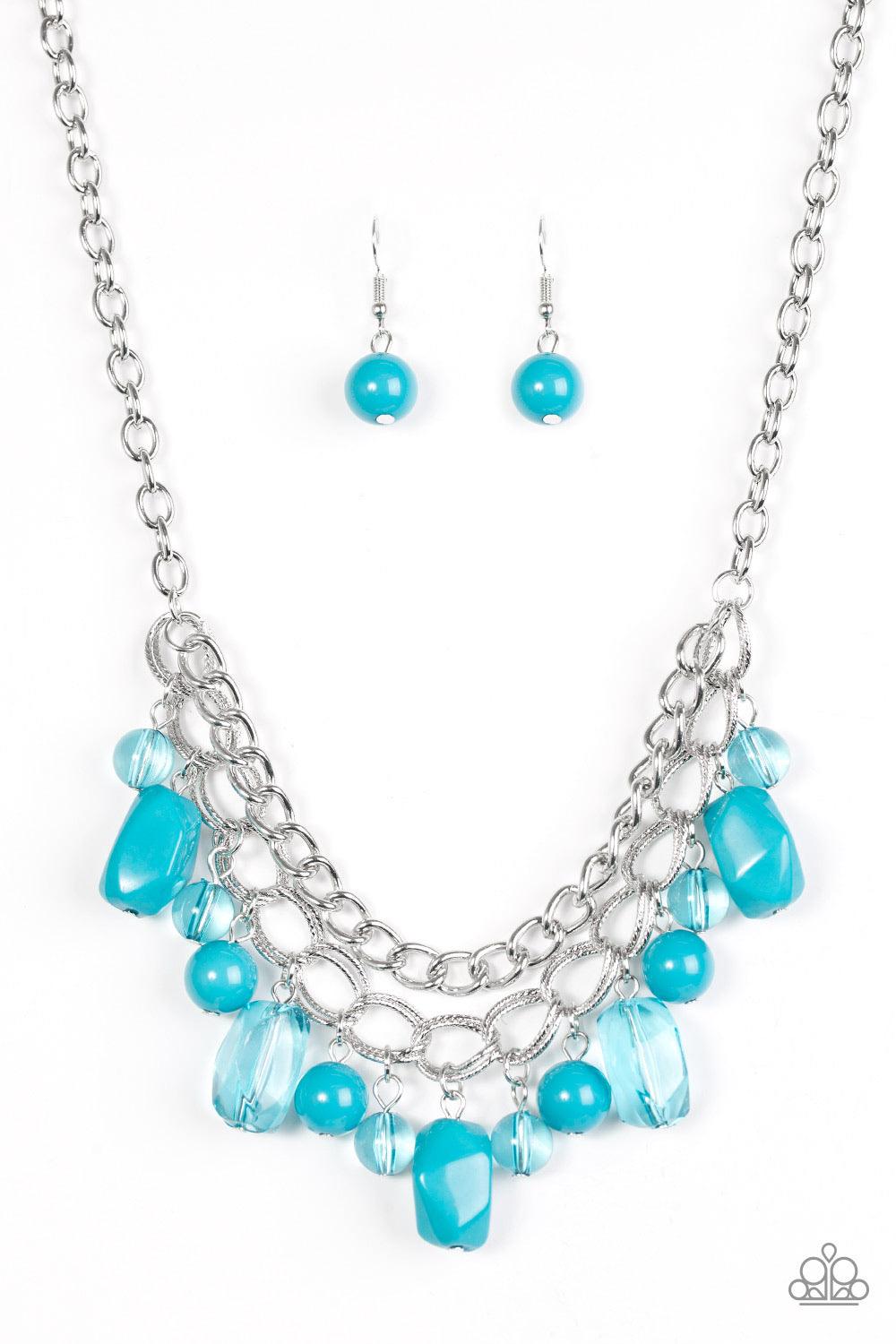 Paparazzi Accessories Brazilian Bay - Blue Featuring glassy and polished finishes, round and asymmetrical blue beads trickle from the bottom of a double-linked silver chain. An additional silver chain is layered above the summery beading for a seasonal fi