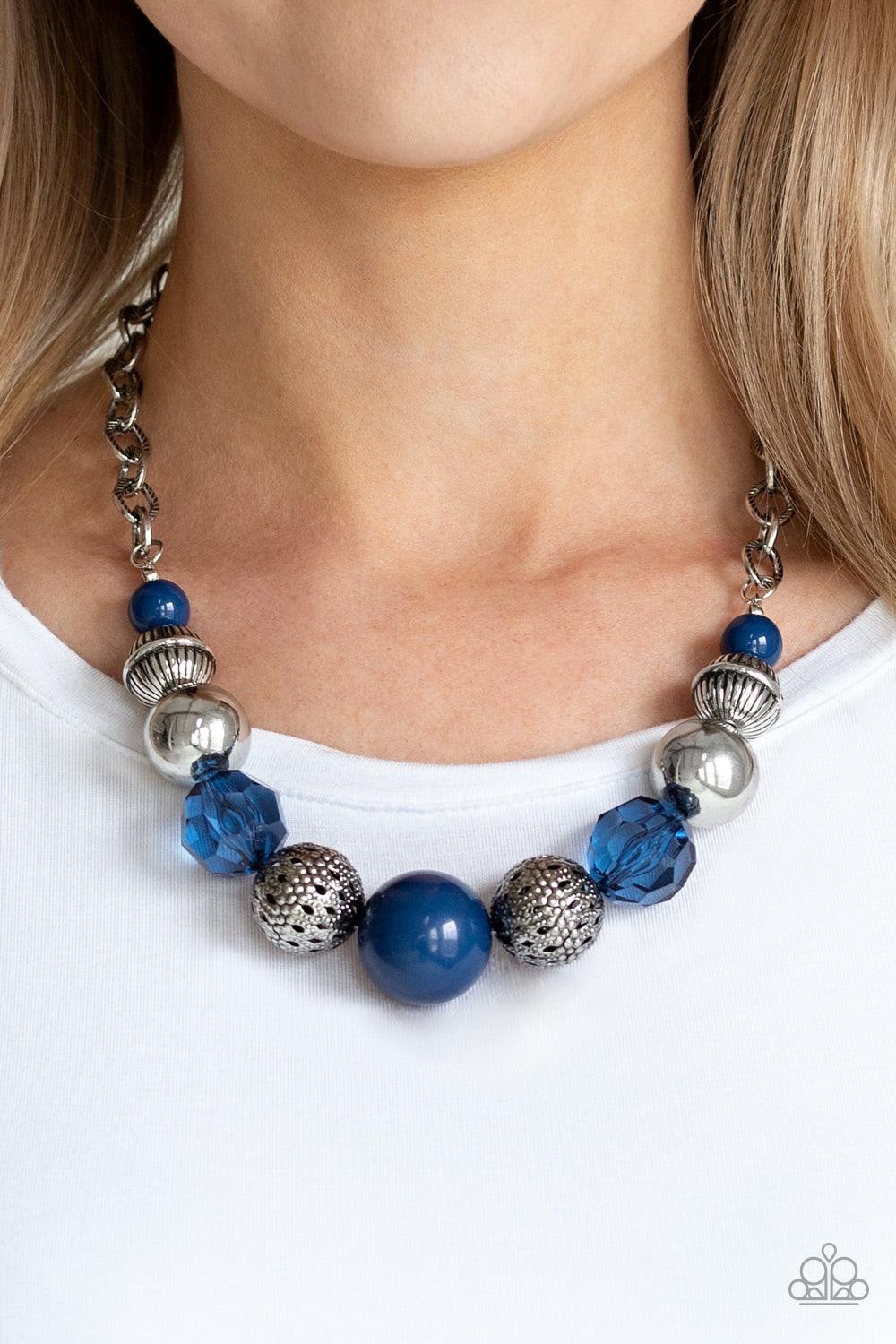 Paparazzi Accessories Sugar, Sugar - Blue A collection of antiqued silver beads, glassy blue crystal-like beads, and oversized blue beads are threaded along an invisible wire below the collar. Textured in linear patterns, an antiqued silver chain attaches
