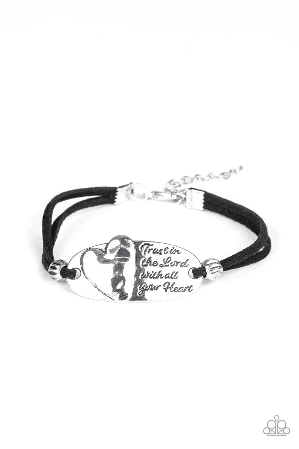 Paparazzi Accessories A Full Heart - Silver nfused with dainty silver beads, strands of black suede knot around a heart decorated frame that has been stamped in the inspirational phrase, "Trust In The Lord With All Your Heart". Features an adjustable clas
