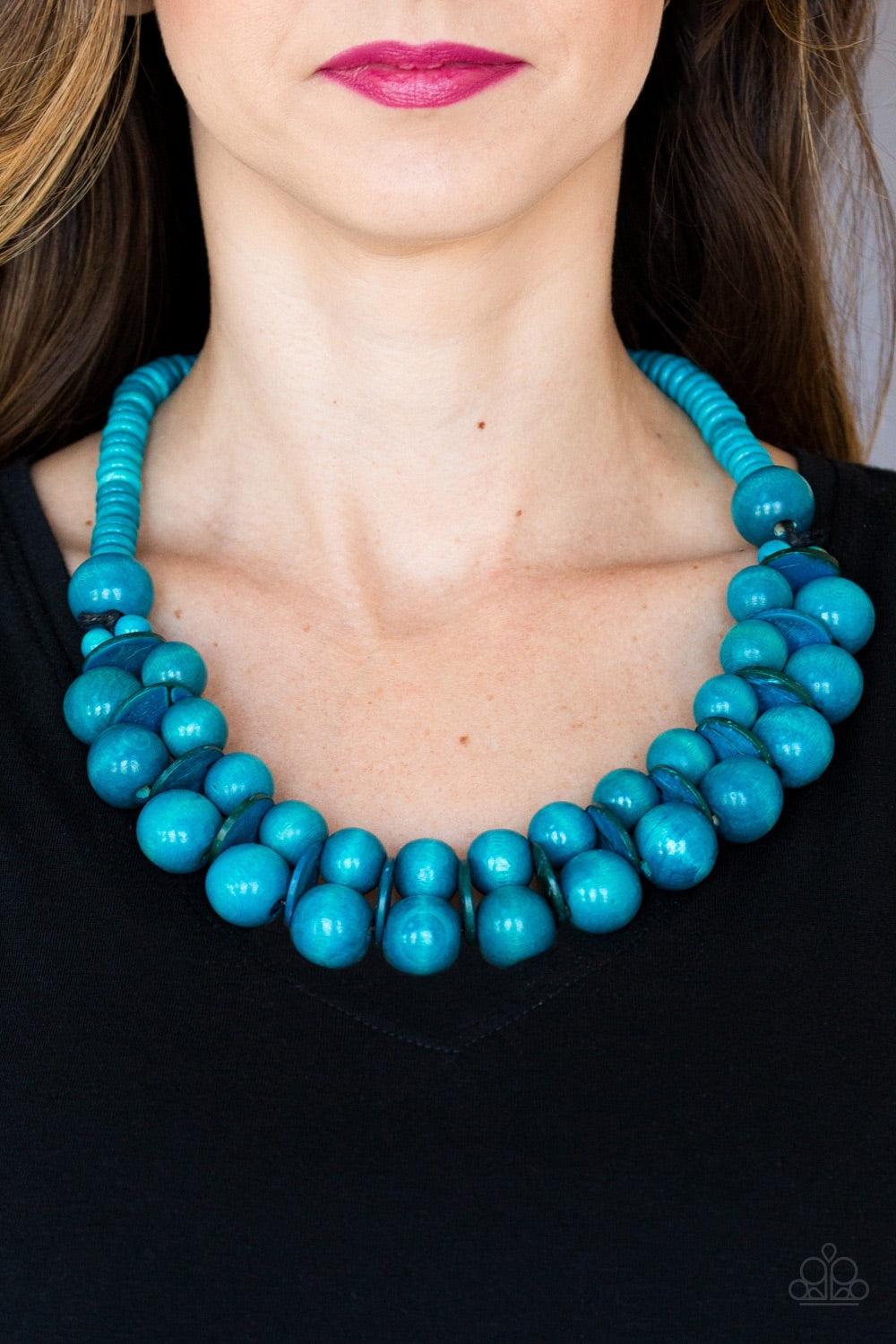 Paparazzi Accessories Caribbean Cover Girl - Blue Brushed in a distressed finish, refreshing blue wooden beads and discs join below the collar for a summery look. Features a button loop closure. Jewelry