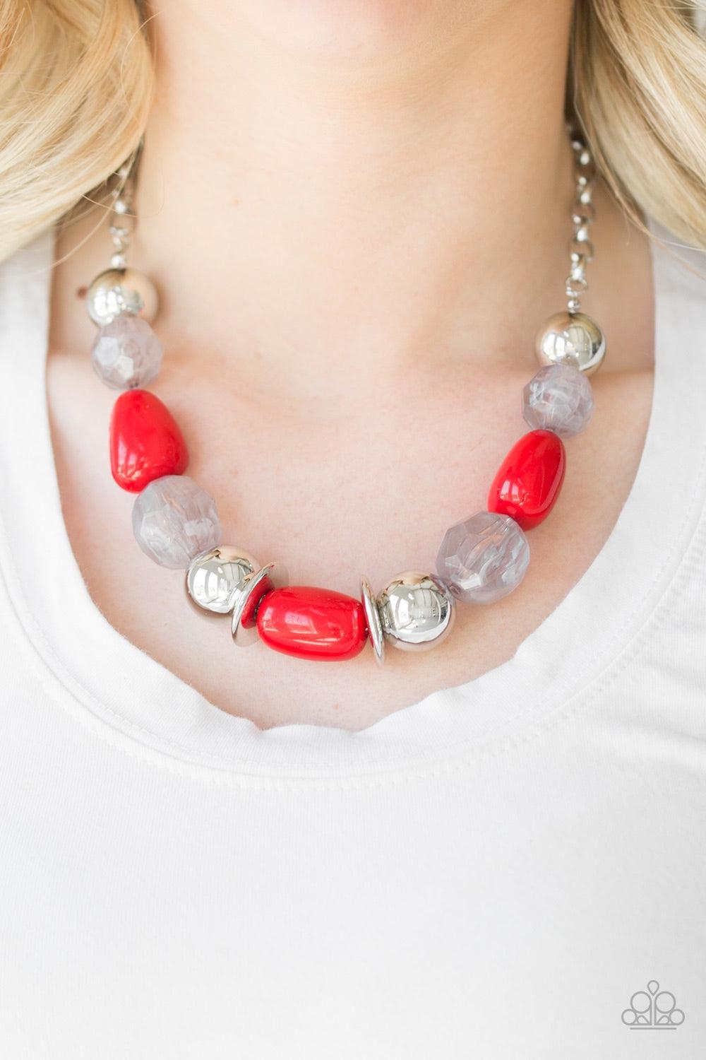 Paparazzi Accessories South Shore Sensation - Red Dramatic silver, fiery red, and faceted cloudy beads are threaded along an invisible wire below the collar for a seasonal look. Features an adjustable clasp closure. Jewelry