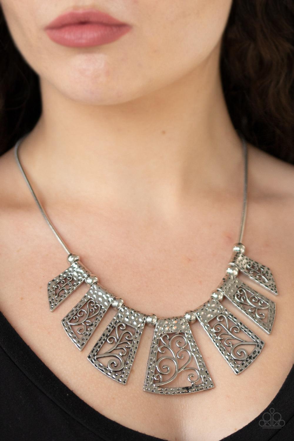 Paparazzi Accessories Vintage Vineyard ~Silver Infused with antiqued silver beads, a collection of hammered silver frames filled with vine-like filigree slide along a sleek silver chain below the collar for a statement-making finish. Features an adjustabl