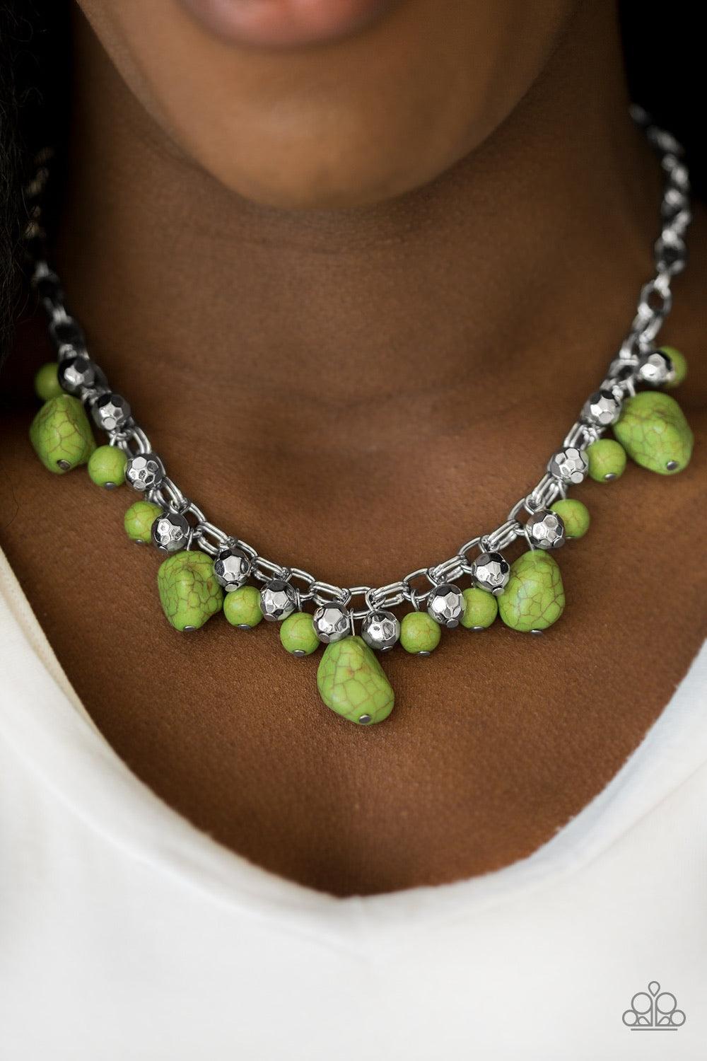 Paparazzi Accessories Paleo Princess - Green Featuring round and asymmetrical cuts, refreshing green stones trickle from the bottom of a double chain-linked chain. Faceted silver beads trickle between the stones, adding a splash of metallic shimmer to the