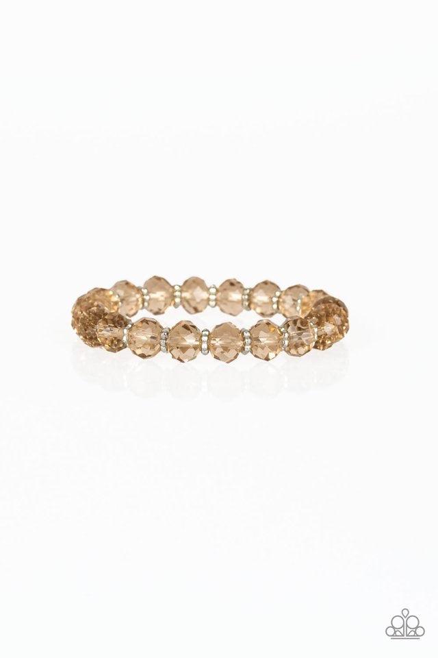 Paparazzi Accessories Crystal Candelabras - Brown Glittery crystal-like beads and studded silver rings are threaded along a stretchy band around the wrist for a sophisticated look. Jewelry