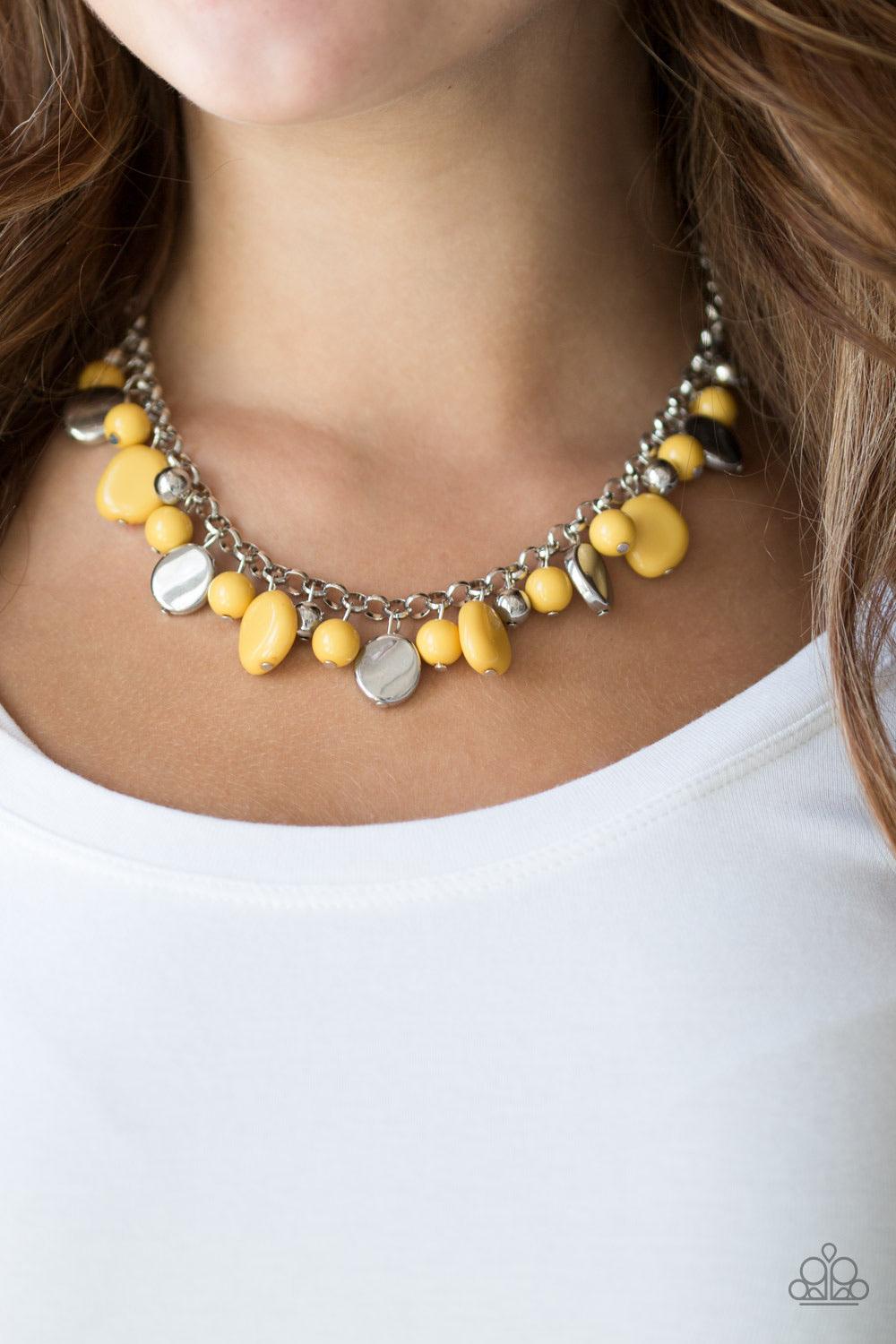 Paparazzi Accessories Flirtatiously Florida ~Yellow Featuring round and asymmetrical shapes, shiny silver and yellow beads swing from the bottom of a bold silver chain, creating a flirtatious fringe below the collar. Features an adjustable clasp closure.