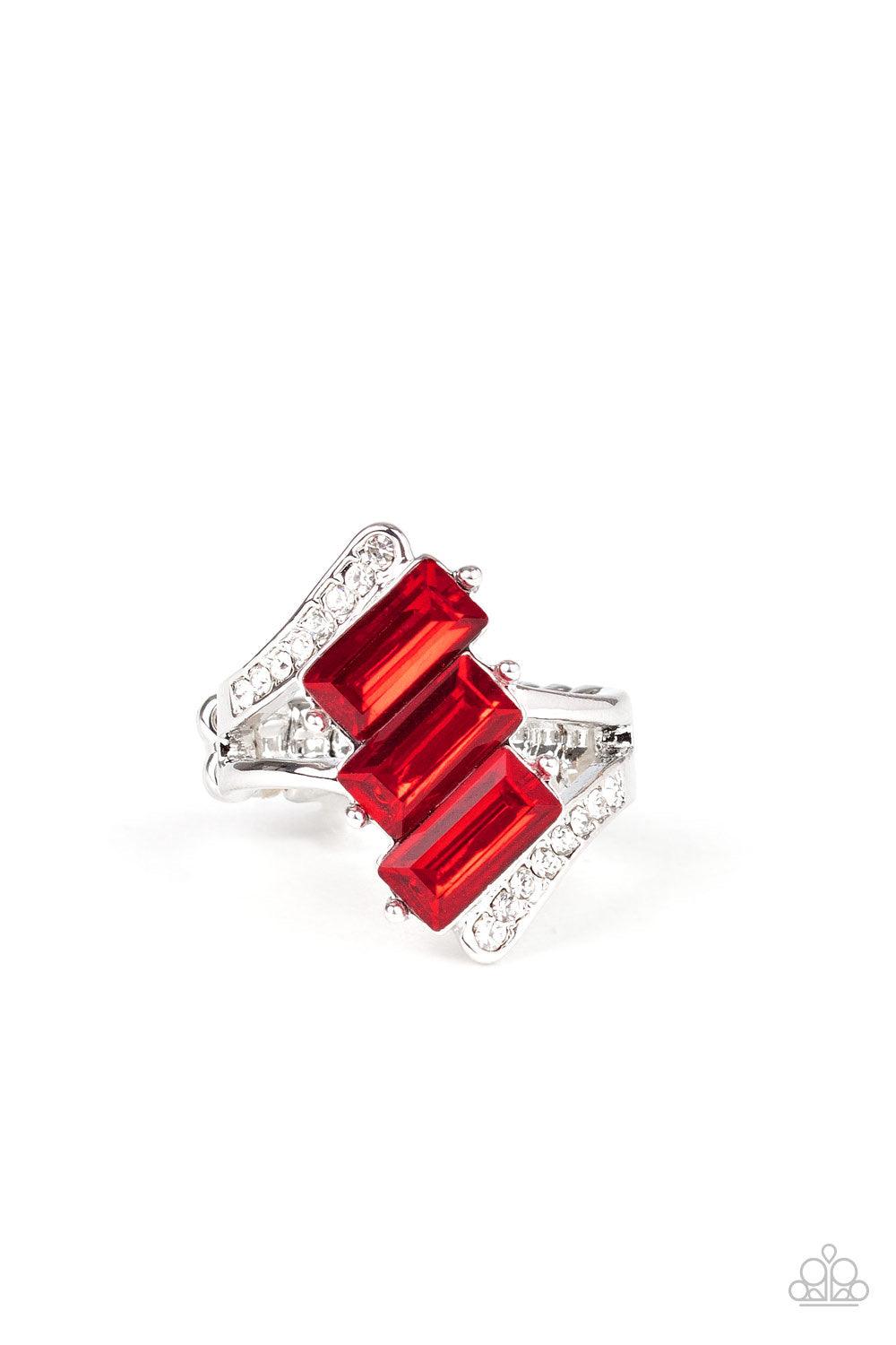 Paparazzi Accessories Triple Razzle ~Red Nestled between two dazzling white rhinestone encrusted silver fittings, three emerald cut red rhinestone slant across the finger for a glamorous look. Features a dainty stretchy band for a flexible fit.