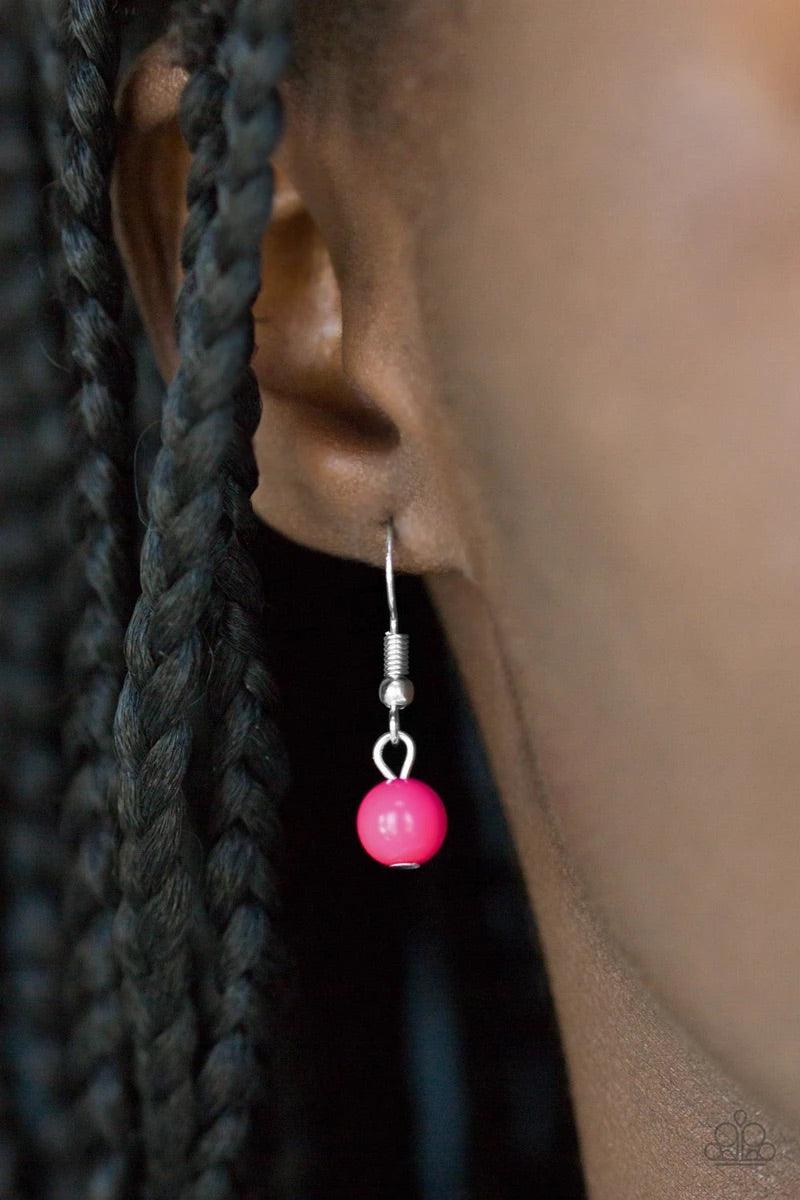 Paparazzi Accessories Gypsy Heart - Pink Shimmery silver layers cascade below the collar. Infused with hints of vivacious pink beading, dainty silver hearts and a delicately hammered silver disc swing from the bottoms of the chains for a whimsical finish.