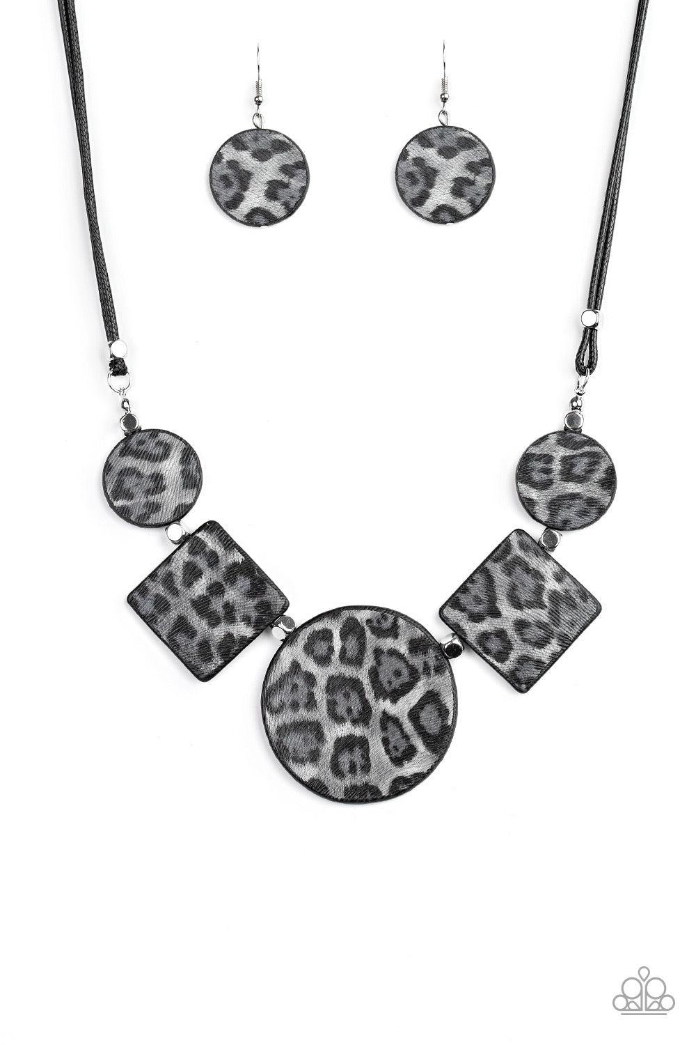 Paparazzi Accessories Here Kitty Kitty - Silver Featuring textured gray cheetah print, a wild collection of circle and square leather pieces are threaded along an invisible wire below the collar for a fierce look. Features an adjustable clasp closure. Sol