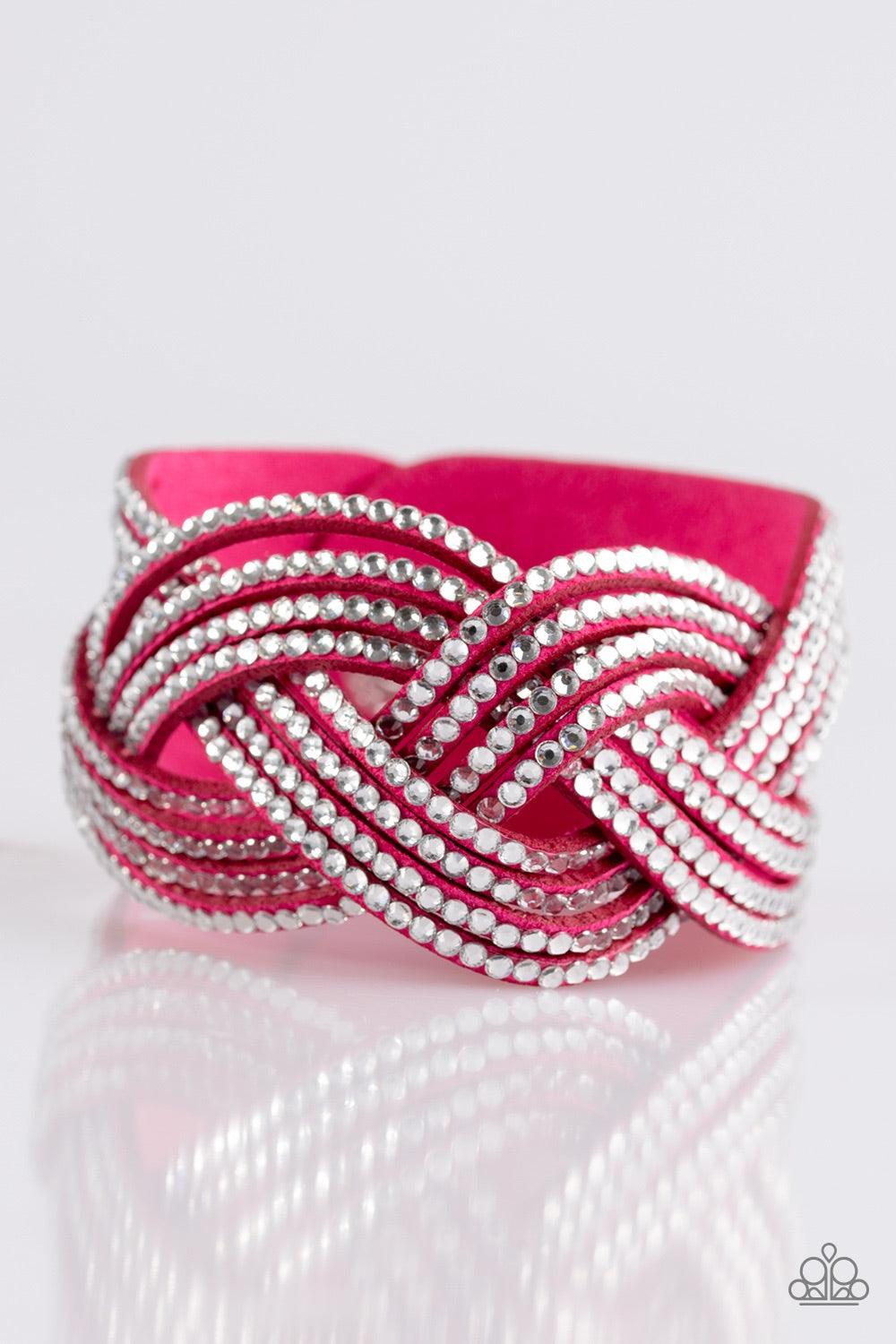 Paparazzi Accessories Big City Shimmer - Pink Glassy white rhinestones are encrusted along crisscrossing strands of pink suede, creating bold shimmer around the wrist. Features an adjustable snap closure. Jewelry