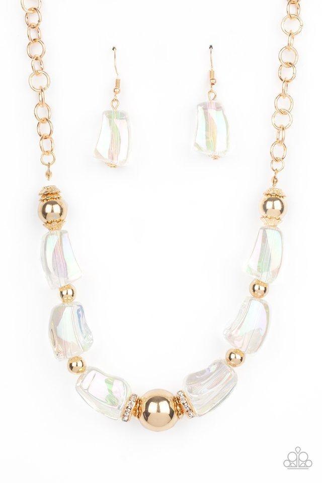 Paparazzi Accessories Iridescently Ice Queen - Gold Featuring an icy iridescence, glassy asymmetrical beads joins a mismatched collection of gold beads, white rhinestone encrusted rings, and scalloped gold accents below the collar. Attached to a gold chai