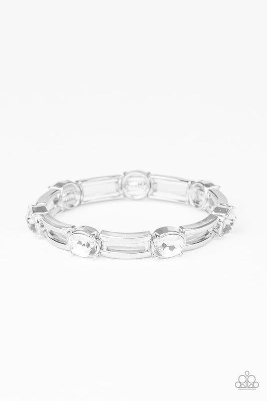 Paparazzi Accessories FLASH or Credit? - White A glittery collection of white rhinestones and airy rectangular silver frames are threaded along stretchy bands around the wrist for a glitzy look. Sold as one individual bracelet. Jewelry