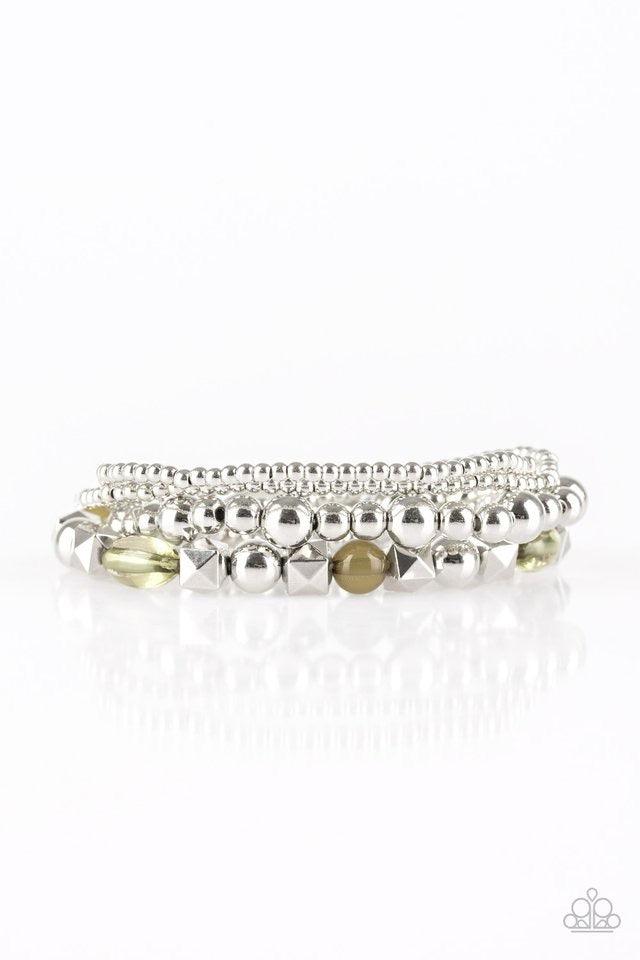 Paparazzi Accessories Babe-alicious - Green Mismatched silver beads and glassy green beads are threaded along stretchy bands, creating colorful layers across the wrist. Sold as one set of four bracelets. Jewelry