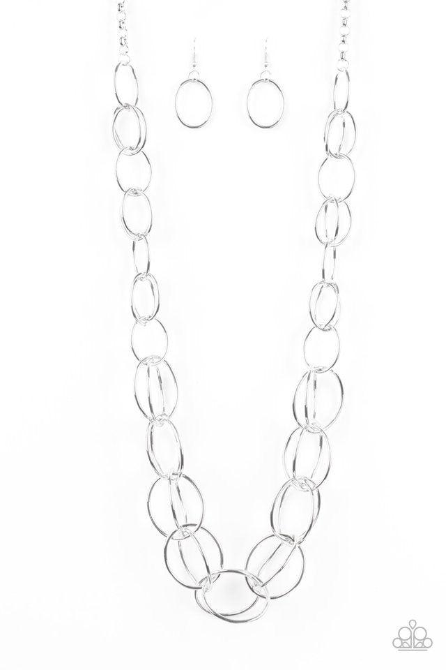 Paparazzi Accessories Elegantly Ensnared - Silver Gradually increasing in size, a collection of bold silver hoops link to a dramatically interconnected chain for a statement-making look. Features an adjustable clasp closure. Jewelry