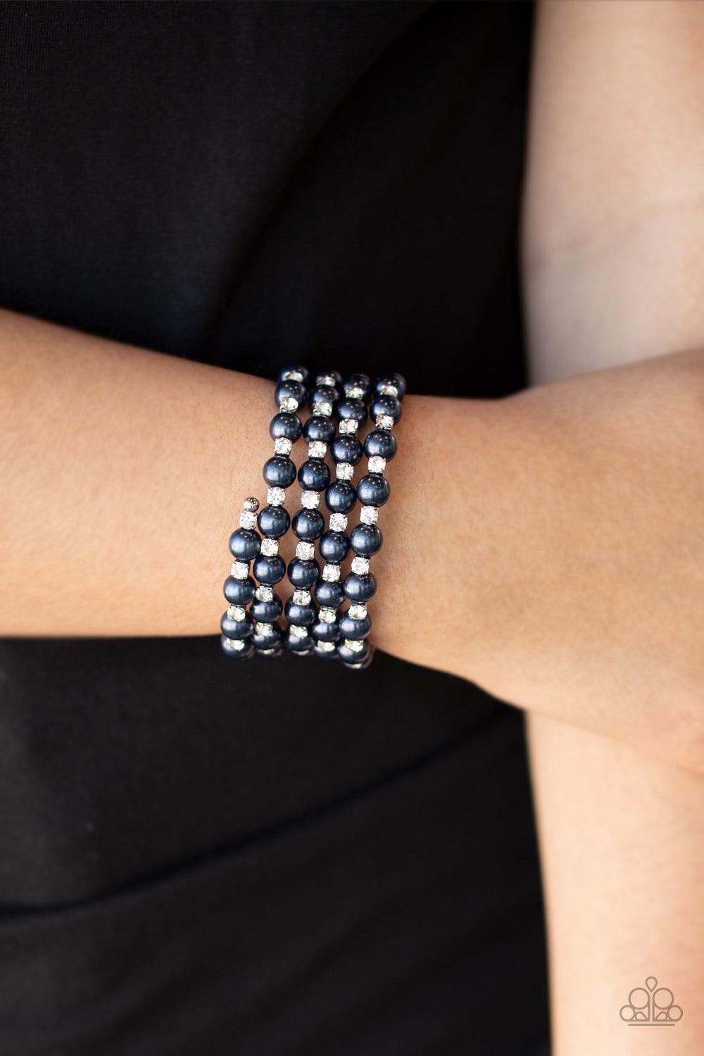 Paparazzi Accessories Rich Royal - Blue Bubbly blue pearls and classic white rhinestone encrusted silver frames are threaded along a coiled wire, creating a timeless infinity wrap style bracelet. Sold as one individual bracelet. Jewelry