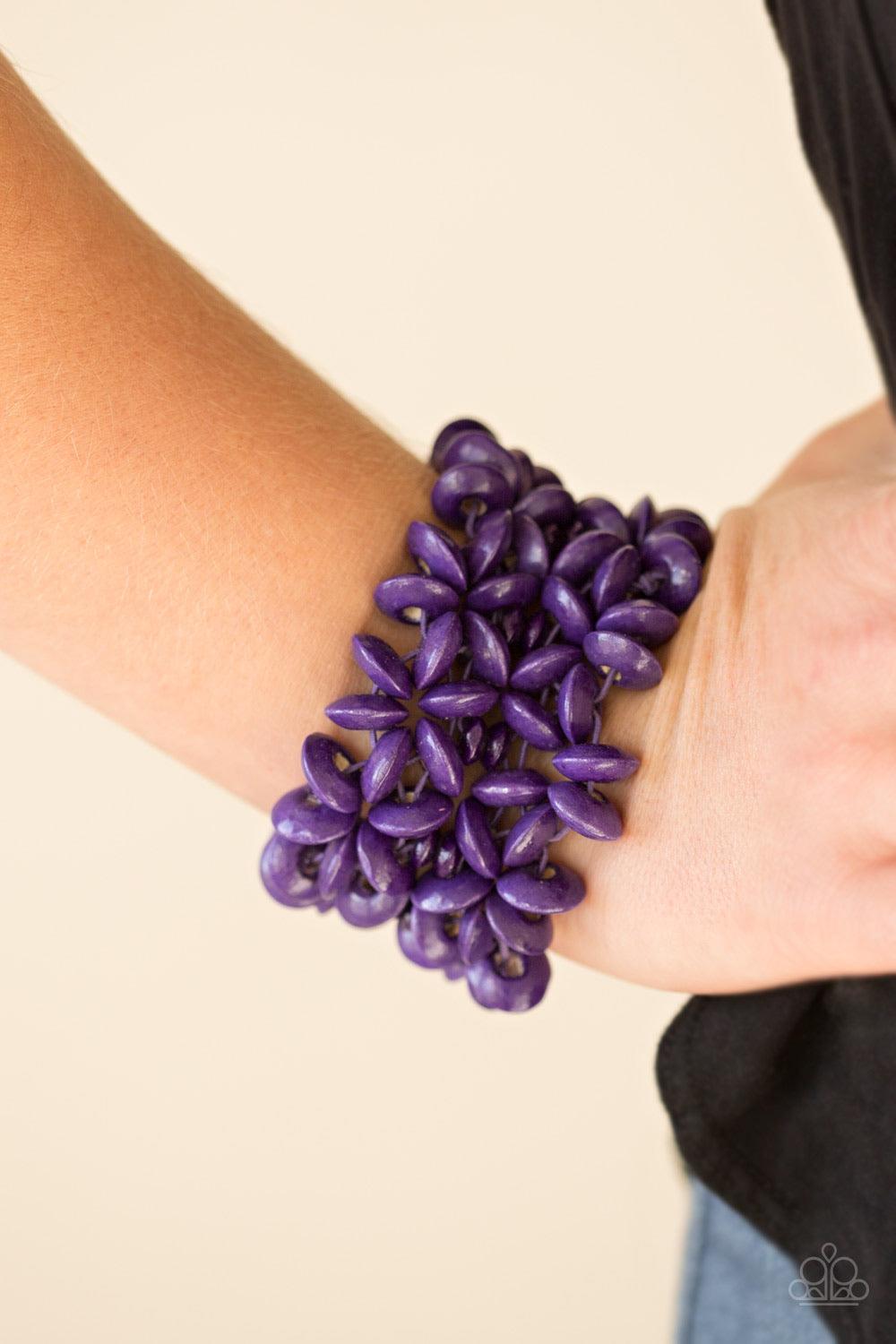 Paparazzi Accessories Hawaii Haven - Purple Vivacious purple wooden accents are threaded along elastic stretchy bands, creating summery floral patterns across the wrist for a seasonal look. Sold as one individual bracelet. Jewelry
