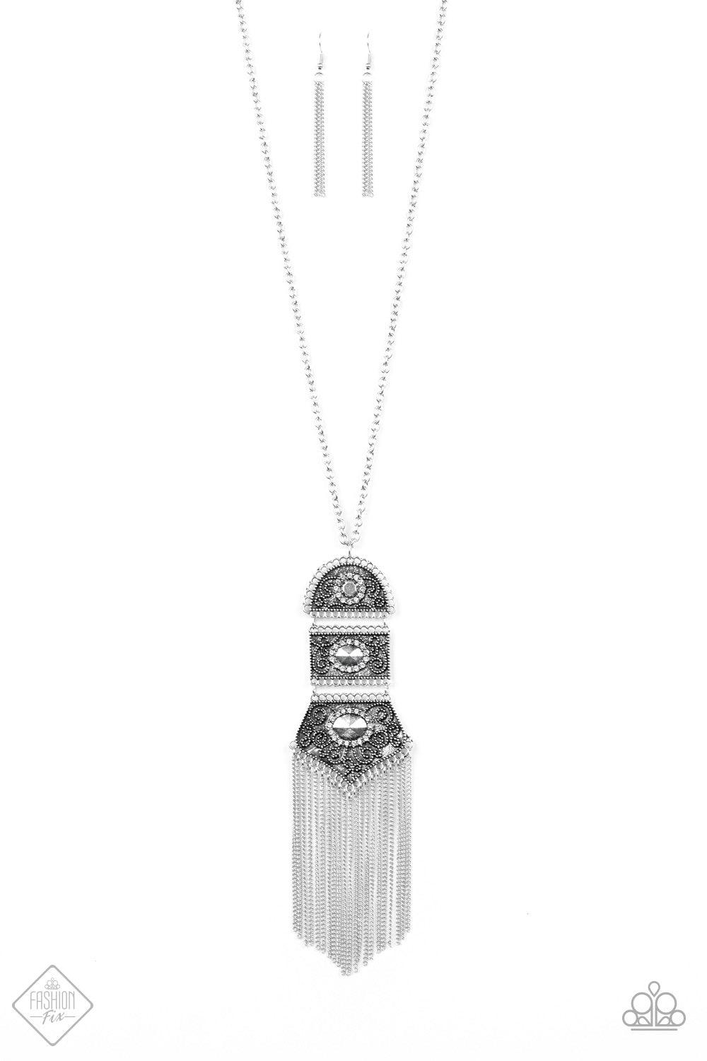 Paparazzi Accessories Tassel Tycoon - Silver Silver beads encircled by rhinestones are nestled inside a row of three vintage frames that cascade down the chest at the bottom of an elongated silver chain. Glistening silver chains stream from the bottom of