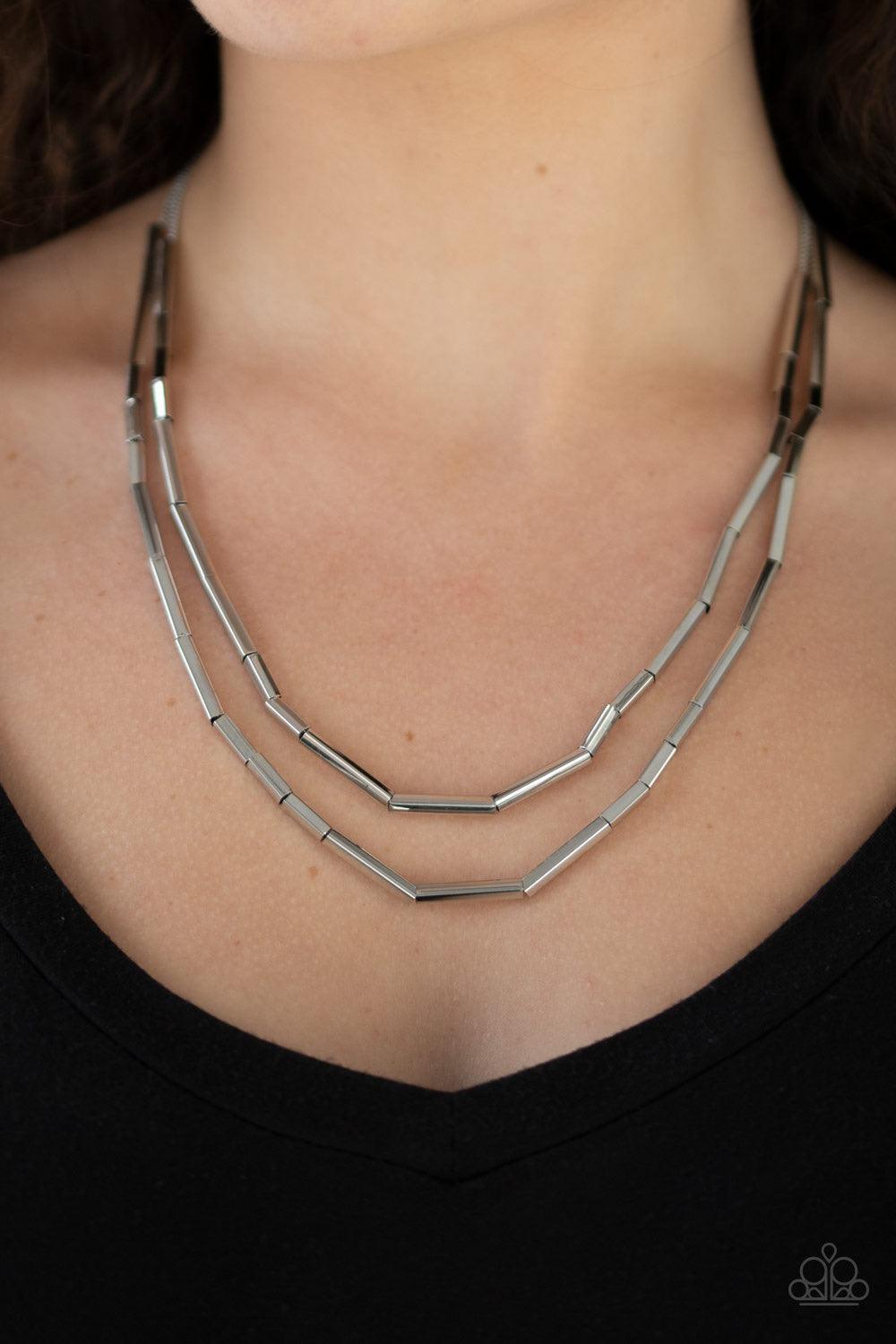 Paparazzi Accessories A Pipe Dream - Silver A collection of square rods slide along two dainty silver chains below the collar, creating edgy metallic layers. Features an adjustable clasp closure. Jewelry