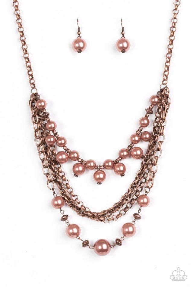 Paparazzi Accessories Urban Riches ~Copper Varying in shape and shimmer, glistening copper chains layer below the collar in a bold industrial fashion. Brushed in a pearly metallic finish, shimmery copper beads and faceted beading trickle along two chains,