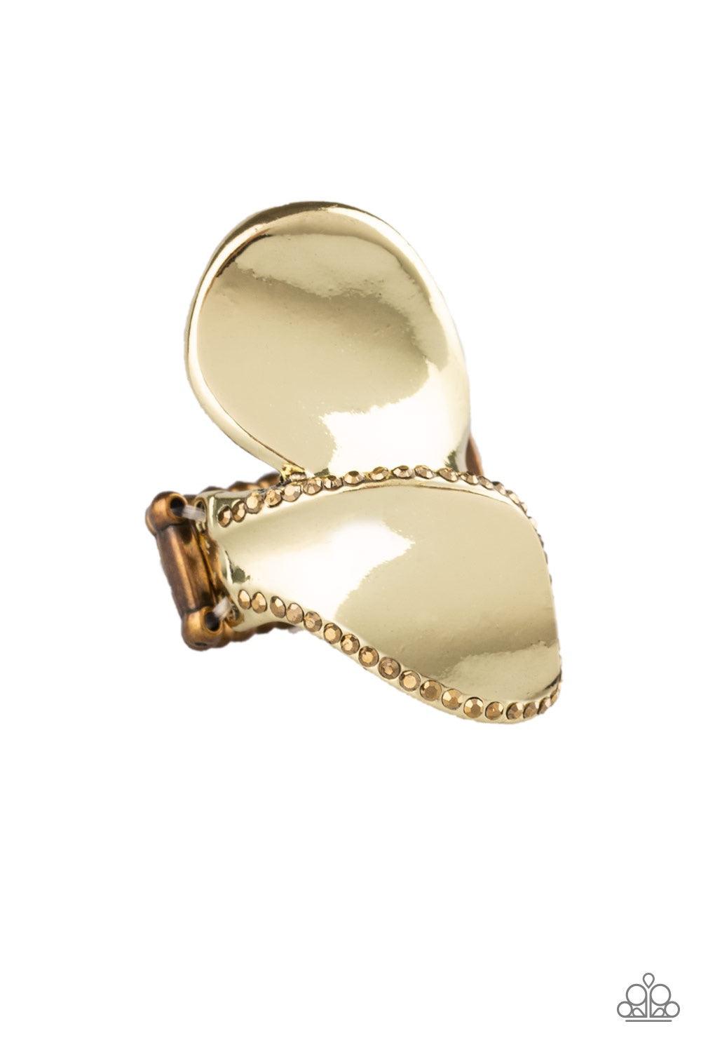 Paparazzi Accessories Fabulously Folded - Brass Bordered in sections of glittery aurum rhinestones, glistening brass frames fold across the finger for an edgy look. Features a stretchy band for a flexible fit. Jewelry
