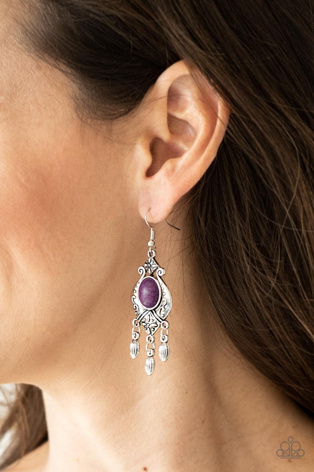Paparazzi Accessories Enchantingly Environmentalist - Purple A vivacious purple stone is pressed into a silver frame radiating with floral details. Dainty silver beads swing from the bottom of the frame, adding a wanderlust finish to the seasonal palette.