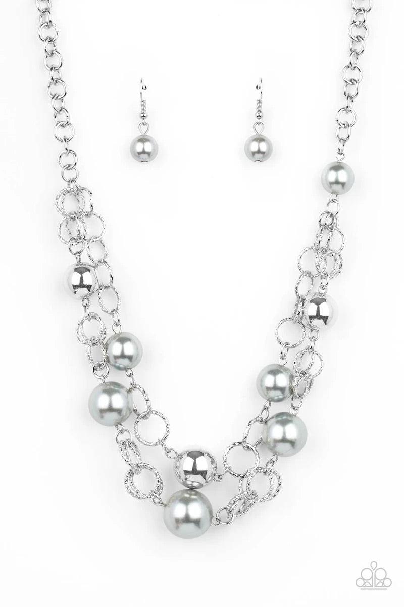 Paparazzi Accessories New Age Knockout - Silver Sections of oversized textured silver links, silver pearls, and shiny silver beads haphazardly connect into two timeless layers below the collar, creating a dramatically refined display. Features an adjustab