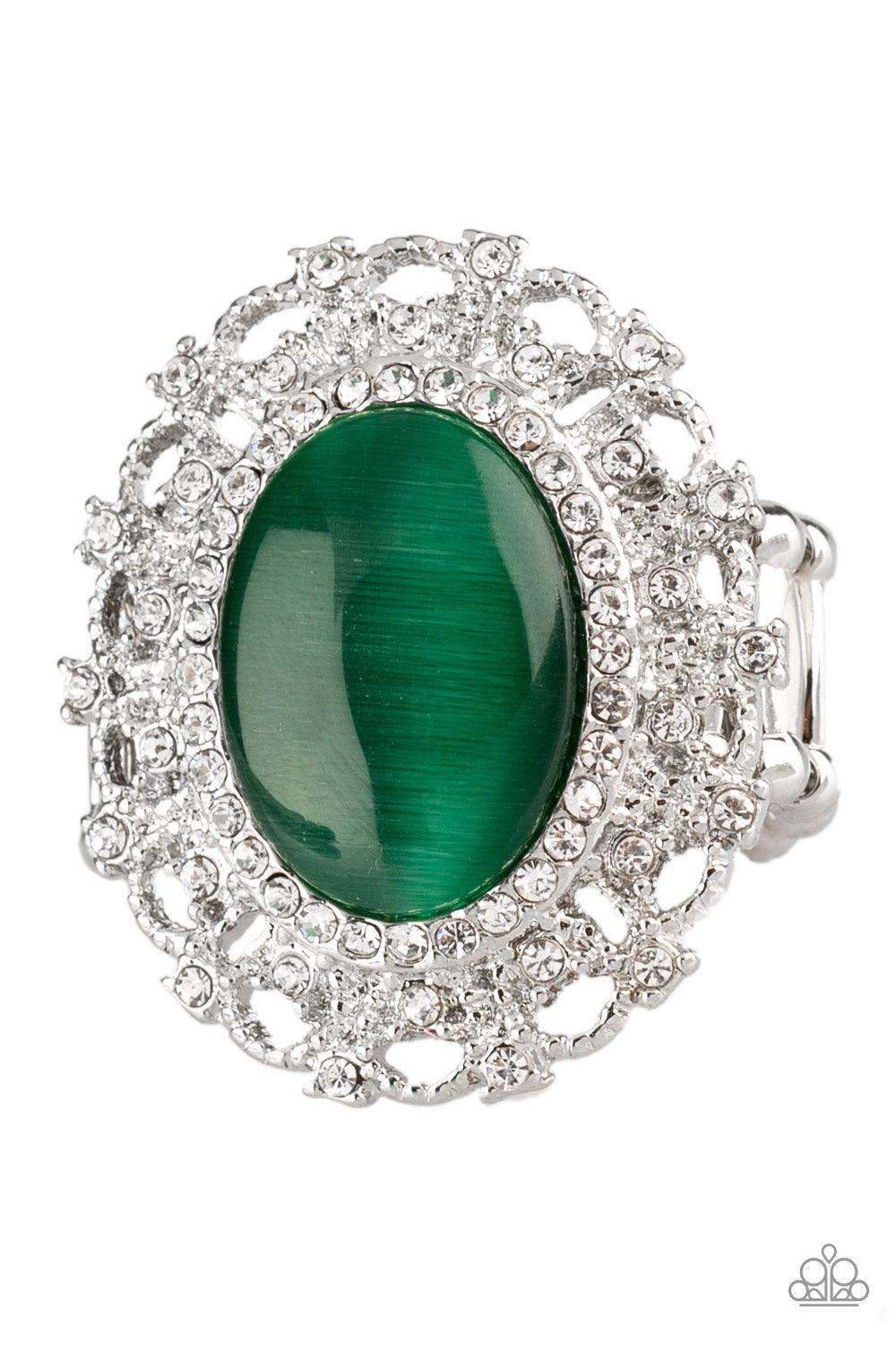 Paparazzi Accessories BAROQUE The Spell - Green Encrusted in dainty white rhinestones, a frilly silver frame spins around a glowing green moonstone center for a regal look. Features a stretchy band for a flexible fit Jewelry