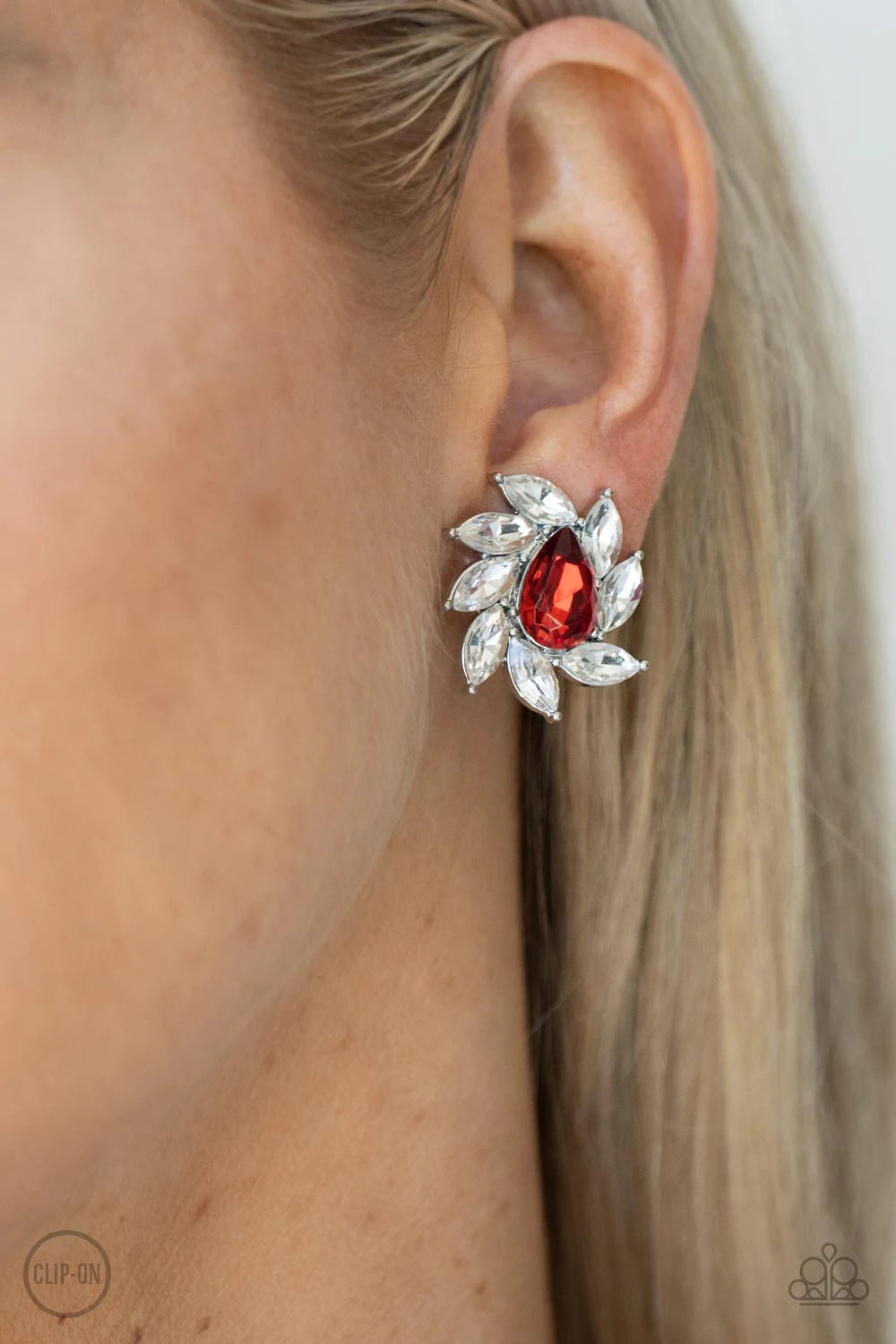 Paparazzi Accessories Sophisticated Swirl - Red *Clip-On A red faceted teardrop gem is encompassed by a radiating frame of sparkling white marquise rhinestones set in silver pronged fittings creating a dramatically vintage finish. Earring attaches to a st
