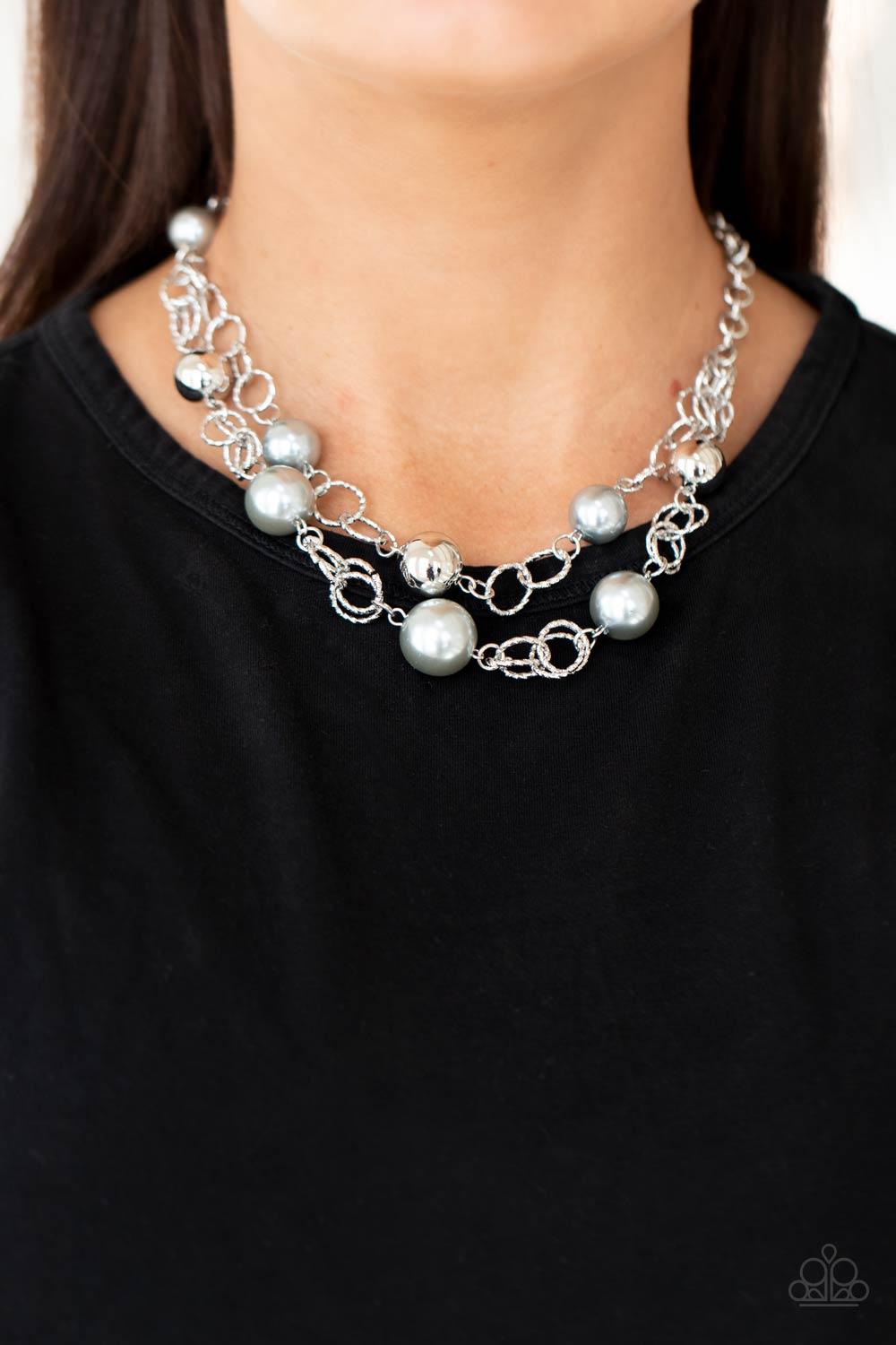 Paparazzi Accessories New Age Knockout - Silver Sections of oversized textured silver links, silver pearls, and shiny silver beads haphazardly connect into two timeless layers below the collar, creating a dramatically refined display. Features an adjustab