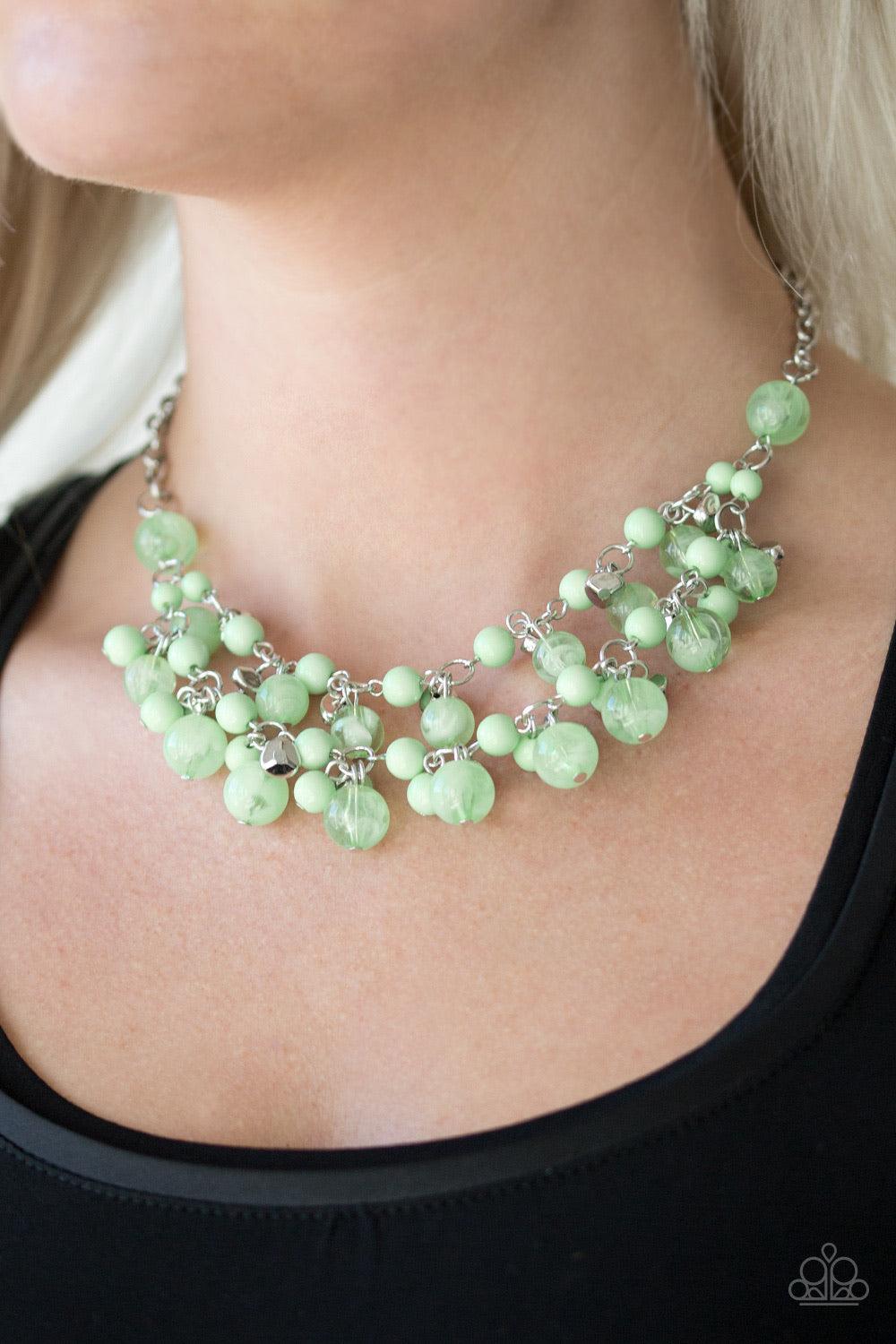 Paparazzi Accessories Gone Sailing - Green Featuring polished and cloudy finishes, refreshing Spearmint beads drip from the bottom of two shimmery silver chains below the collar. Faceted silver beads trickle between the colorful accents, adding a splash o