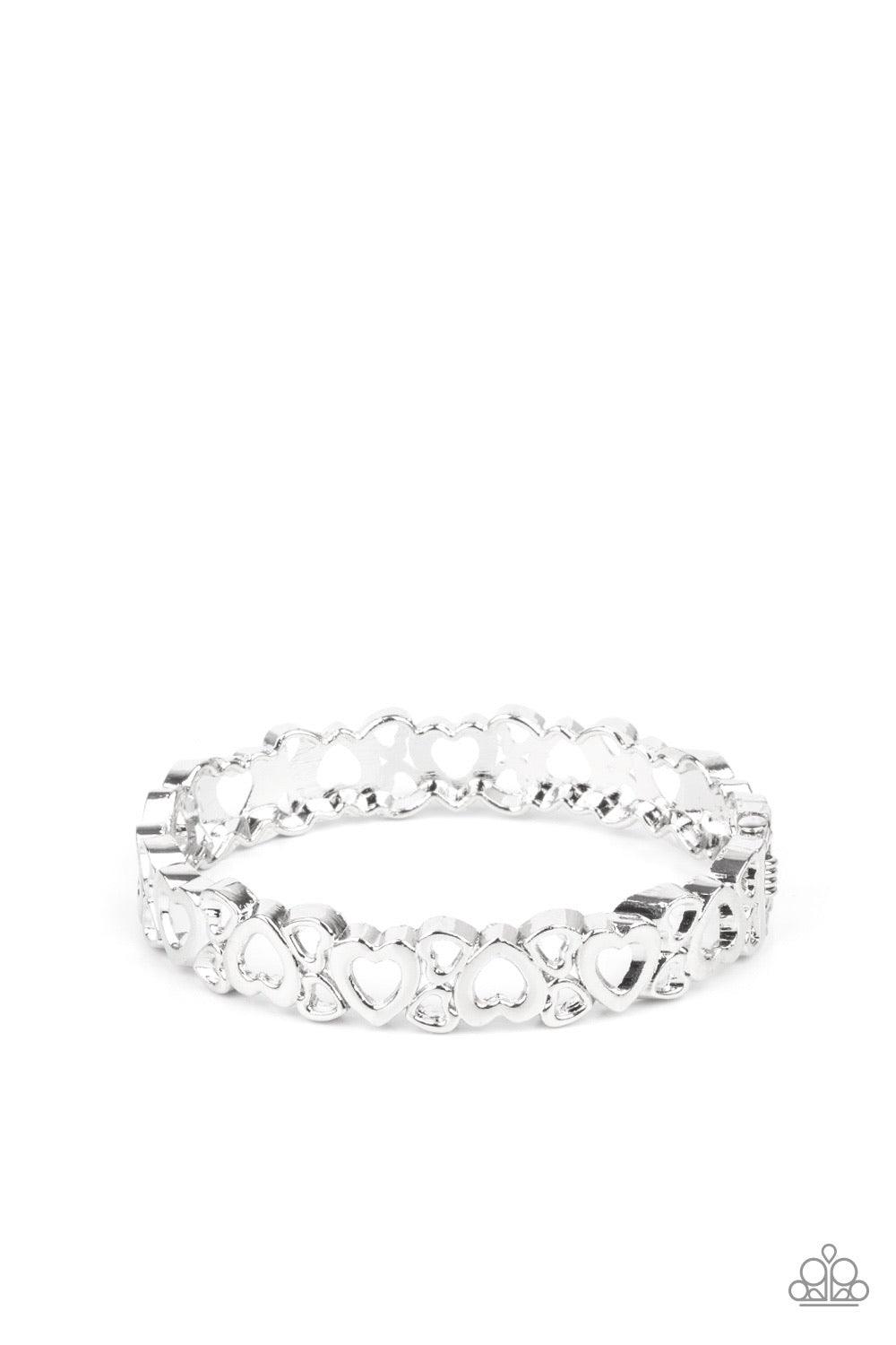 Paparazzi Accessories YOU Heart The Lady! ~Silver A charming collection of airy silver heart frames connects into a dainty bangle-like cuff around the wrist. Features a hinged closure. Sold as one individual bracelet. Bracelet
