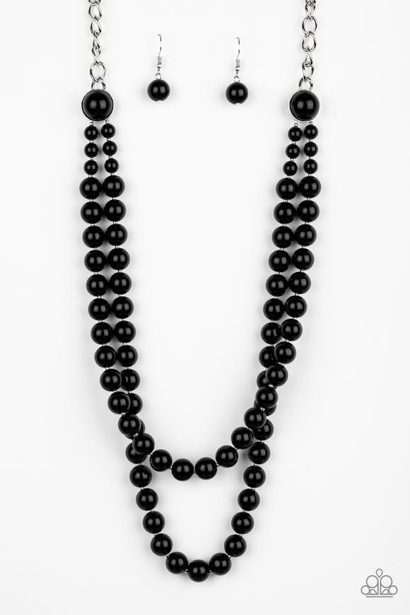 Paparazzi Accessories Endless Elegance - Black A dramatic silver chain gives way to two strands of polished black beads. Infused with matching beaded fittings and dainty silver accents, the beaded strand draped down the chest in a refined fashion. Feature