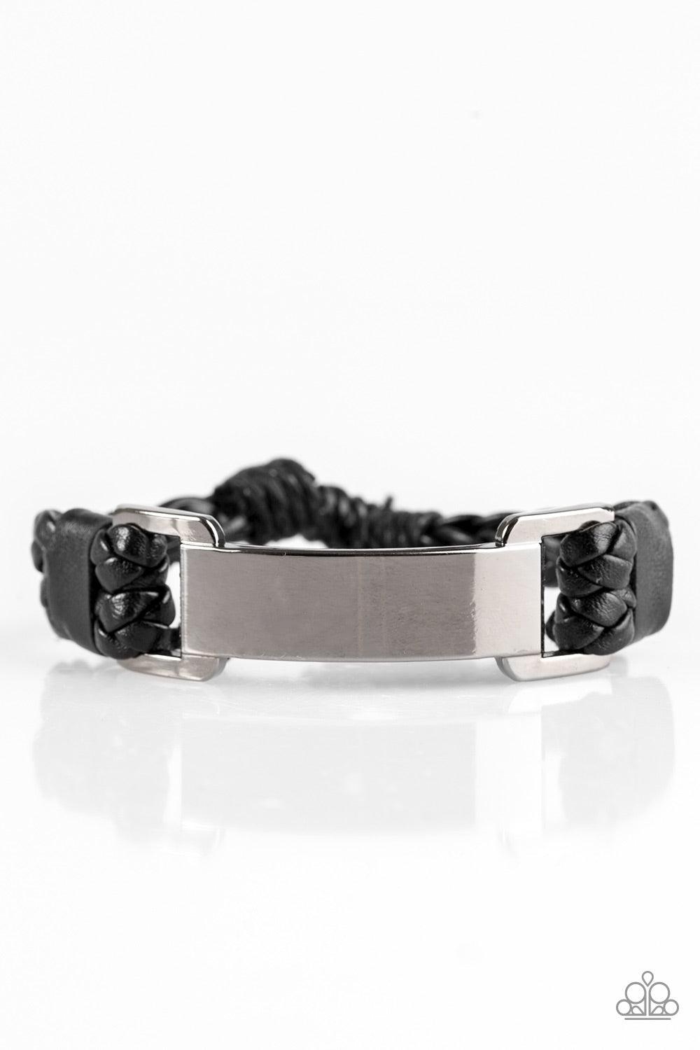 Paparazzi Accessories Traffic Jam - Black Braided black leather bands loop through a glistening gunmetal frame. The shiny leather strands secure the frame in place across the wrist for an urban look. Features an adjustable sliding knot closure. Jewelry