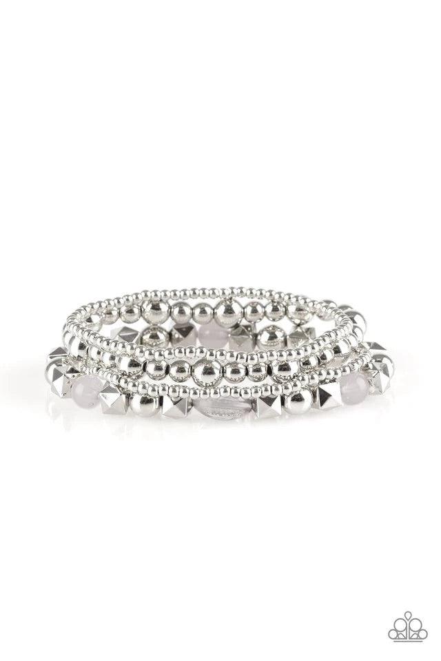 Paparazzi Accessories Babe -alicious - Silver Mismatched silver beads and glassy silver beads are threaded along stretchy bands, creating colorful layers across the wrist. Sold as one set of four bracelets. Jewelry