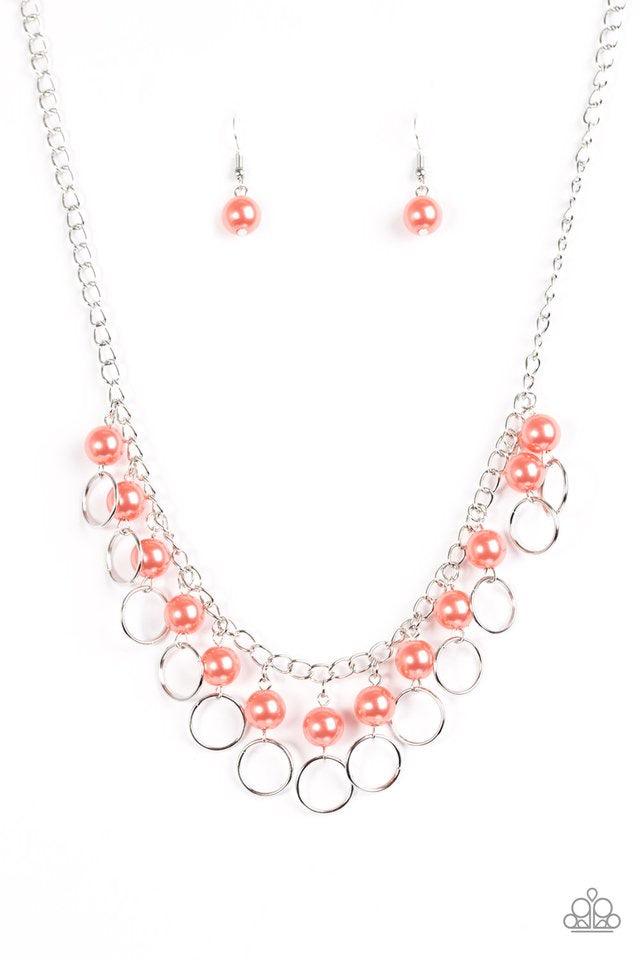 Paparazzi Accessories Run The Show - Orange Classic coral pearls trickle from the bottom of a glistening silver chain. Shimmery silver hoops cascade from the pearls, creating a flirty fringe below the collar. Features an adjustable clasp closure. Sold as