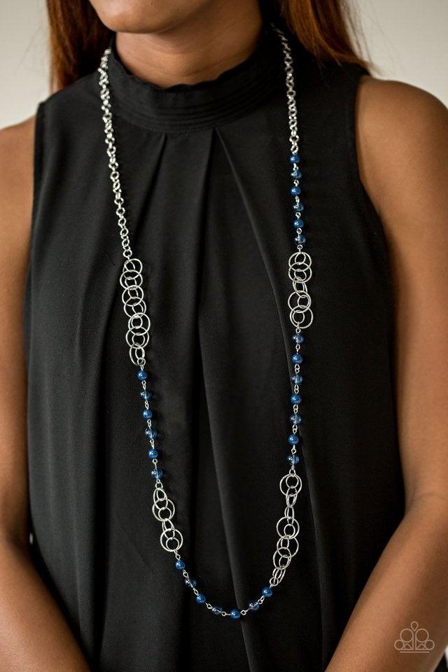 Paparazzi Accessories Dreamy Discovery - Blue Glassy and polished blue beads give way to sections of shimmery silver hoops along a glistening silver chain for a seasonal look. Features an adjustable clasp closure. Sold as one individual necklace. Includes