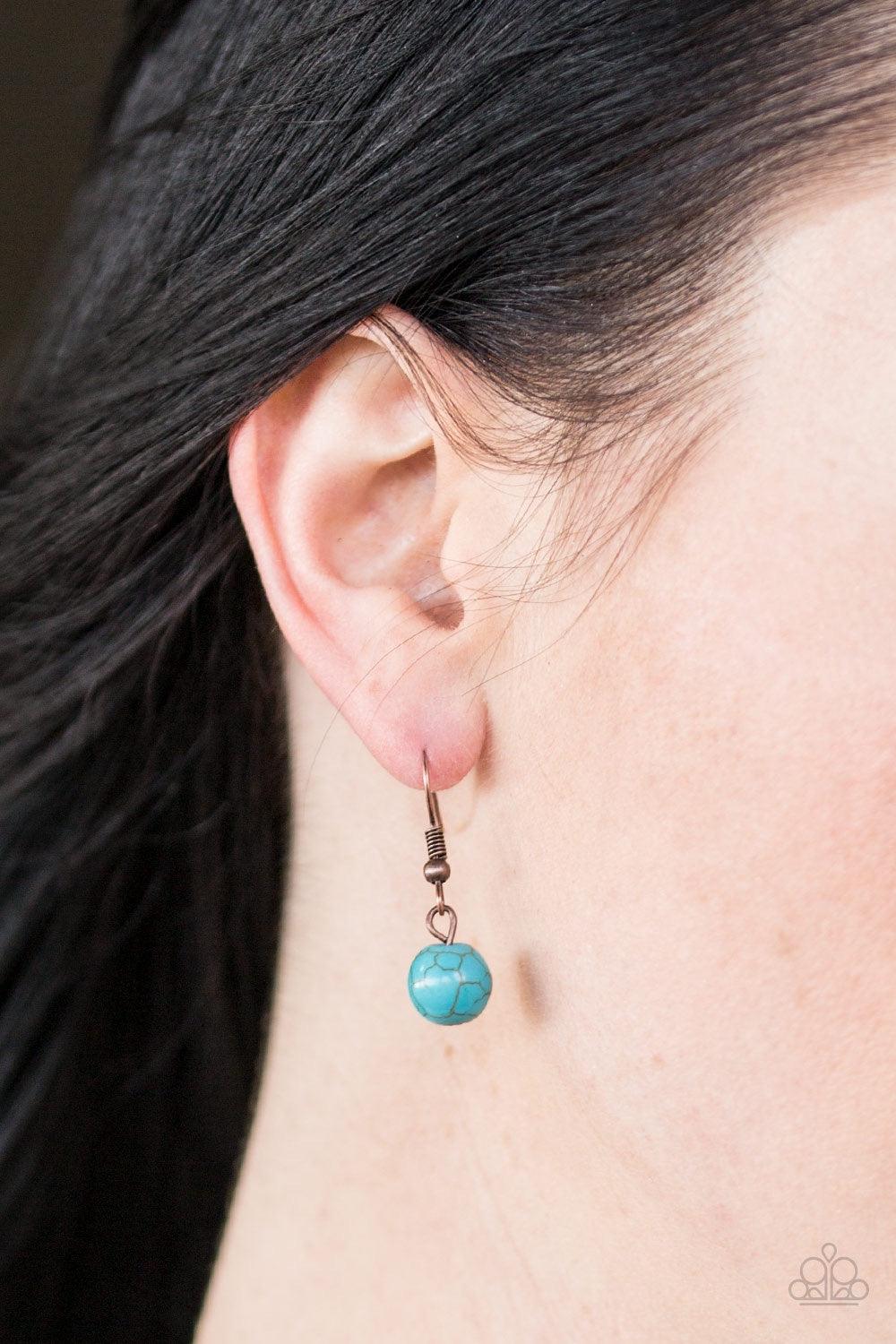 Paparazzi Accessories Mesa Moon - Cooper Chiseled into an earthy crescent, a refreshing turquoise stone attaches to a studded copper frame, creating a bold artisanal pendant. Features an adjustable clasp closure. Jewelry