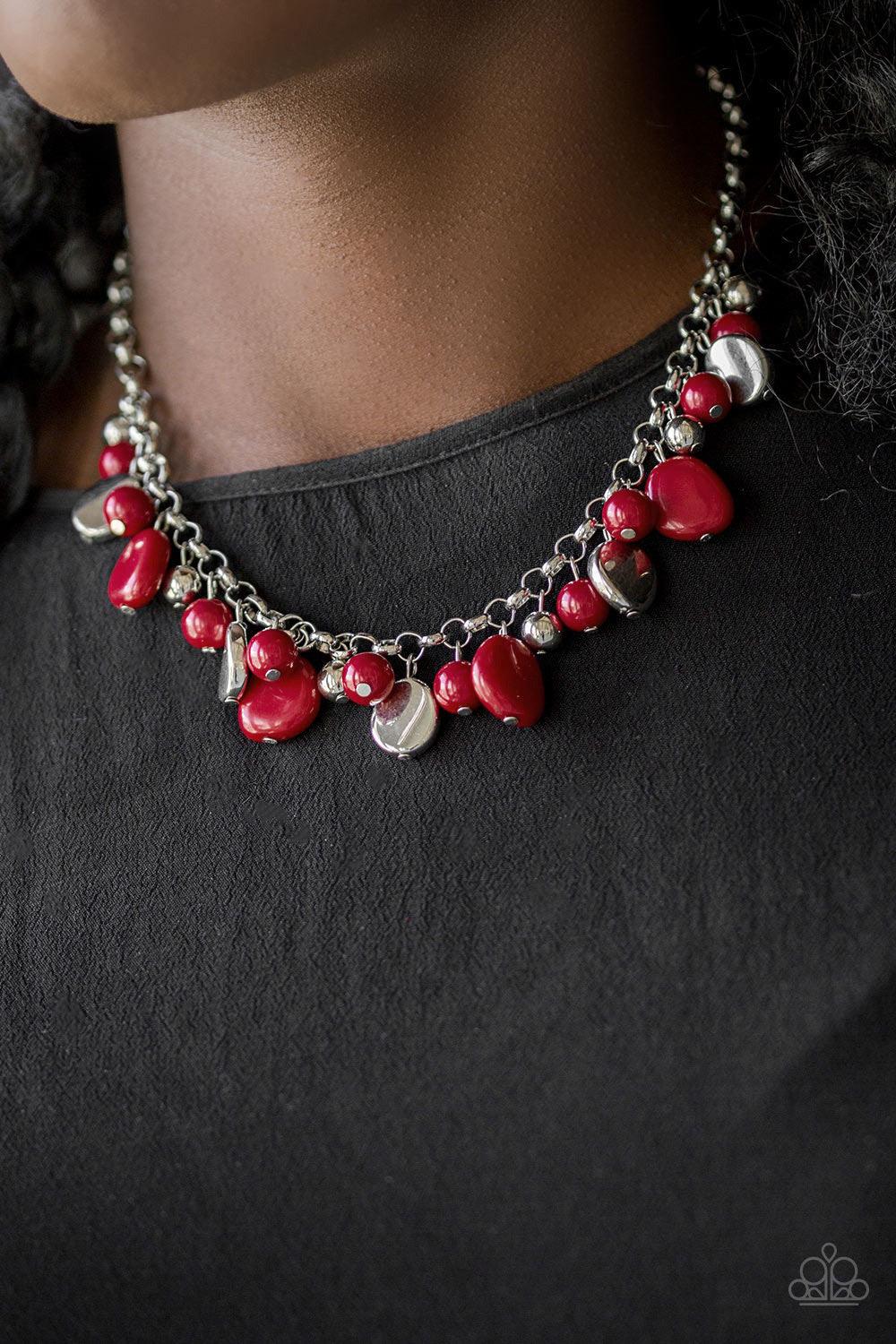 Paparazzi Accessories Flirtatiously Florida ~Red Featuring round and asymmetrical shapes, shiny silver and red beads swing from the bottom of a bold silver chain, creating a flirtatious fringe below the collar. Features an adjustable clasp closure.