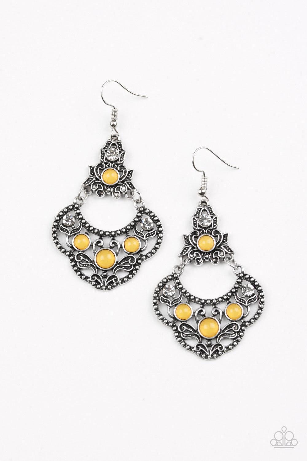 Paparazzi Accessories Garden State Glow - Yellow Glowing yellow beads and glittery white rhinestones are sprinkled along an ornate silver frame radiating with leafy filigree for a whimsical look. Earring attaches to a standard fishhook fitting. Sold as on