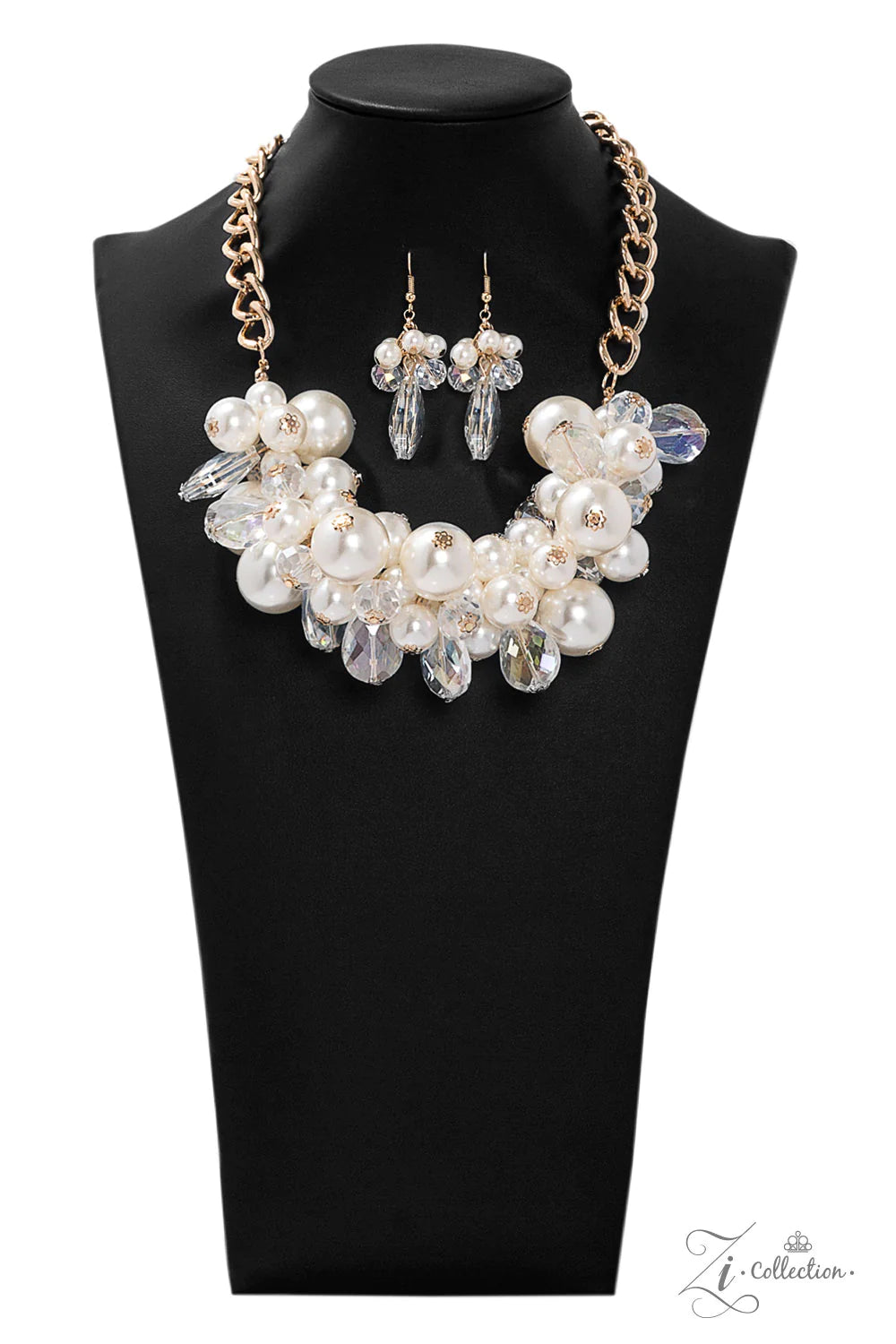 Paparazzi Accessories Captivate An oversized gold chain gives way to an exaggerated cluster of bubbly white pearls, glassy crystal-like beads, and prismatic crystal teardrops. The dramatic fringe converges below the collar, creating a breathtaking stateme