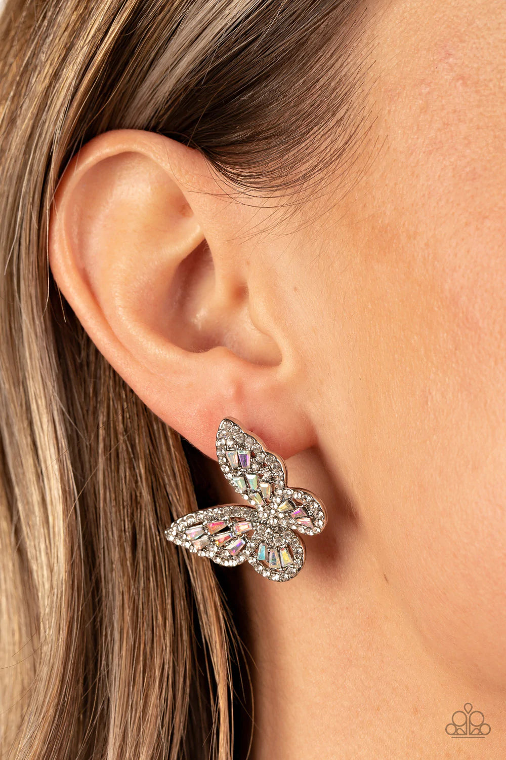 Paparazzi Accessories Smooth Like Flutter - Multi Bordered in dainty white rhinestones, emerald cut iridescent rhinestones sparkle inside the silver wings of a butterfly for an enchanting fashion. Earring attaches to a standard post fitting. Jewelry