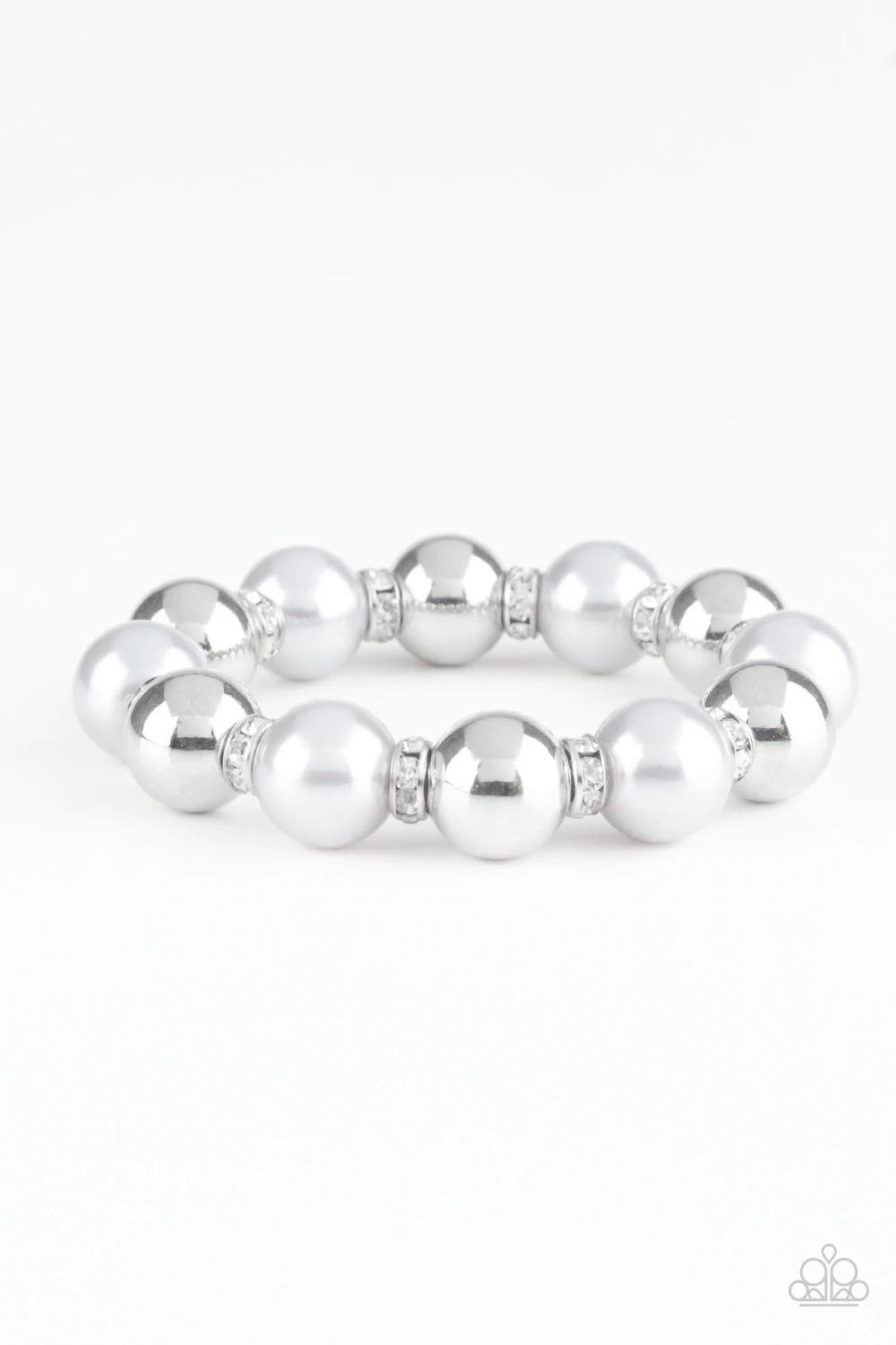 Paparazzi Accessories So Not Sorry - White A collection of white rhinestone encrusted rings, silver pearls, and classic silver beads are threaded along a stretchy band around the wrist for a glamorous look. Sold as one individual bracelet. Jewelry