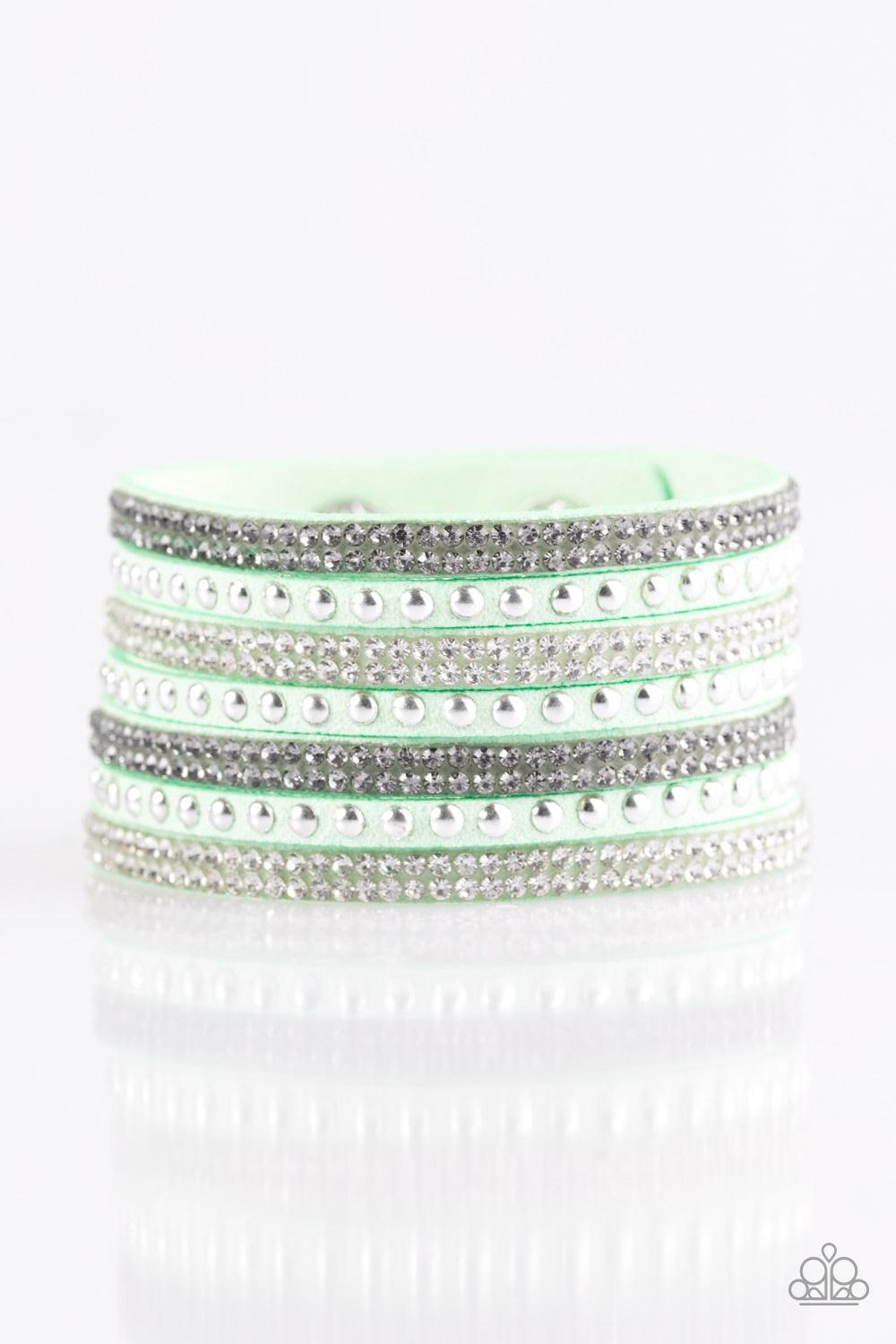 Paparazzi Accessories Victory Shine - Green Shiny silver studs and rows of smoky and glittery white rhinestones are encrusted along strips of green suede, creating sassy shimmer around the wrist. Features an adjustable snap closure. Jewelry