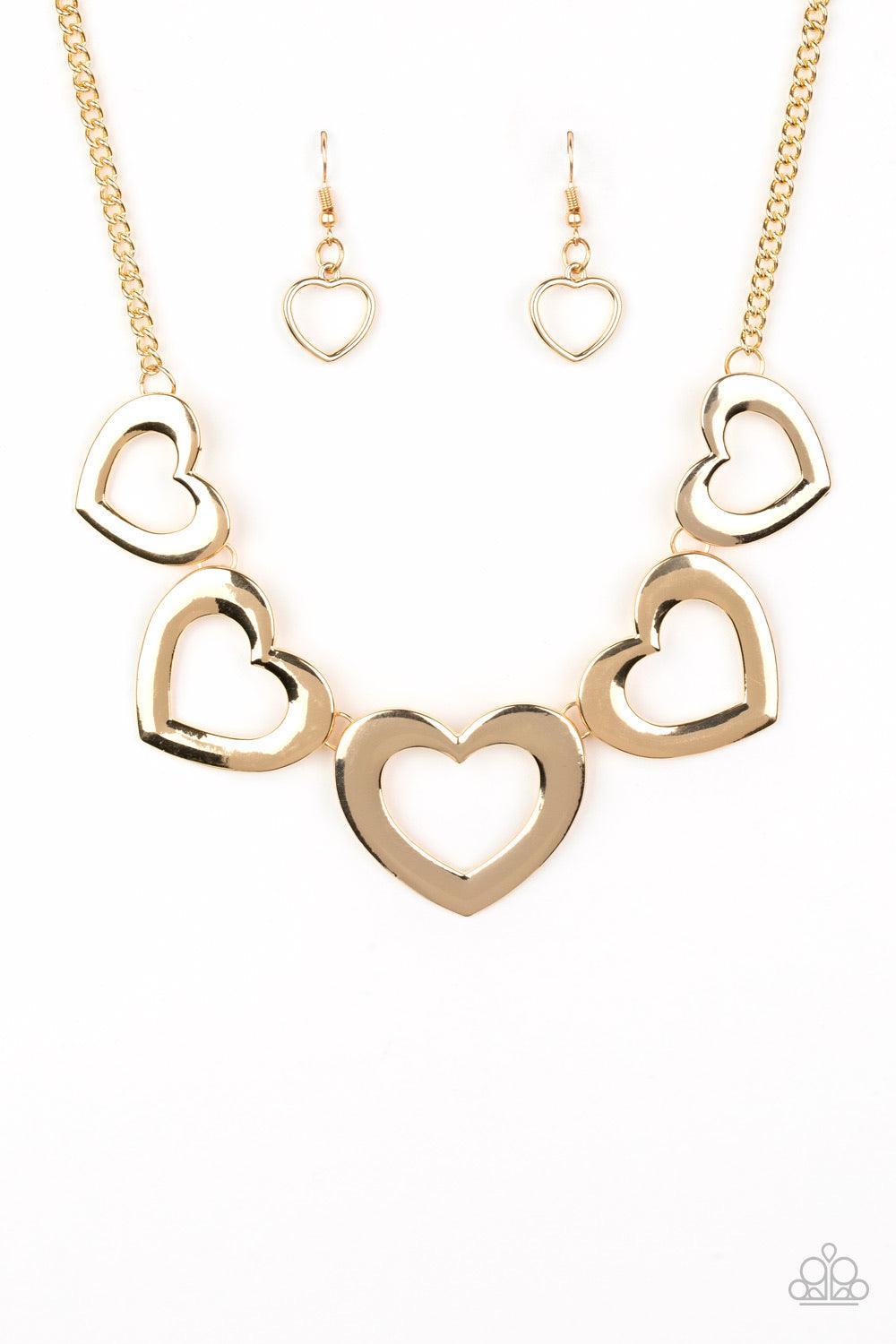 Paparazzi Accessories Hearty Hearts - Gold Gradually increasing in size, glistening gold heart silhouettes delicately link below the collar in a charming fashion. Features an adjustable clasp closure. Jewelry