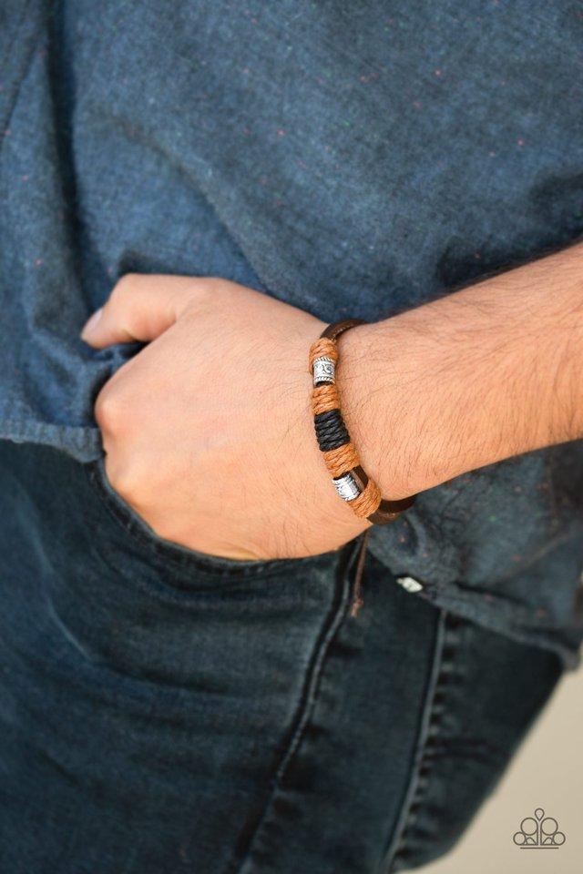 Paparazzi Accessories Tundra Trail - Brown Black and brown cording knots ornate silver beads around two brown leather bands for a rugged look. Features an adjustable sliding knot closure. Sold as one individual bracelet. Jewelry