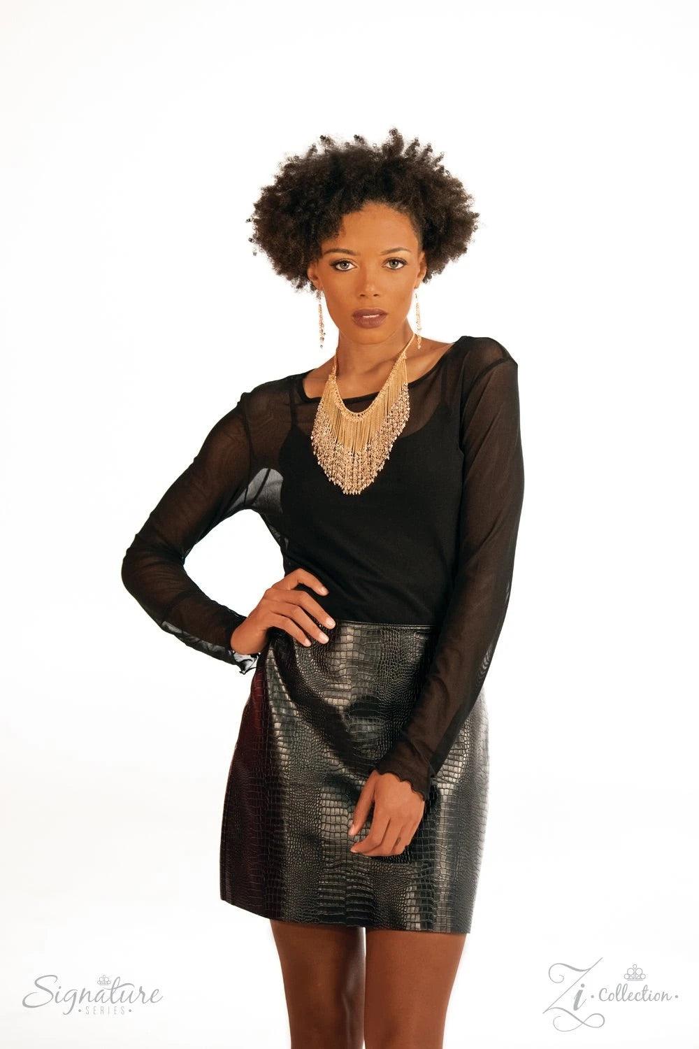 Paparazzi Accessories The DonnaLee Countless gold chains stream from the bottom of a glistening gold chain, creating a curtain of show-stopping fringe that falls just below the collar. Faceted crystal-like beading lays across the top of the cascading chai