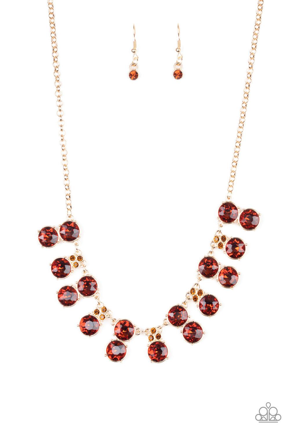 Paparazzi Accessories Top Dollar Twinkle - Brown Pairs of stacked topaz rhinestone frames alternate with solitaire topaz rhinestones crowned in dainty topaz rhinestones along a shiny gold chain, creating a glamorous fringe below the collar. Features an ad