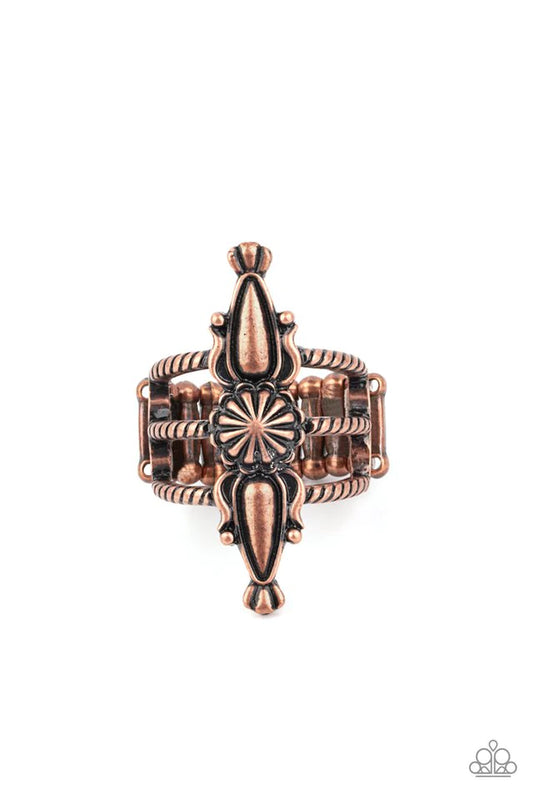 Paparazzi Accessories Westward Expansion - Copper An antiqued copper flower frame is flanked by two decorative copper teardrop frames, creating a rustic centerpiece atop three textured copper bands. Features a stretchy band for a flexible fit. Sold as one