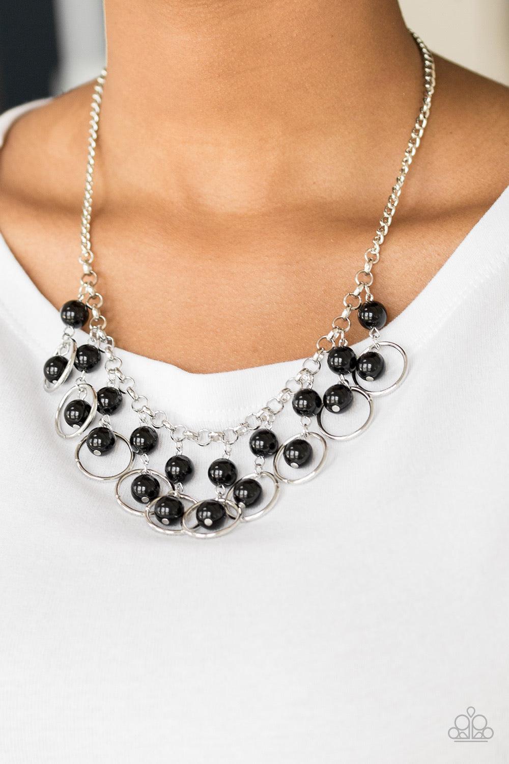 Paparazzi Accessories Really Rococo - Black Polished black beads and shimmery silver hoops drip from the bottom of a glistening silver chain, creating a playful fringe below the collar. Features an adjustable clasp closure. Sold as one individual necklace