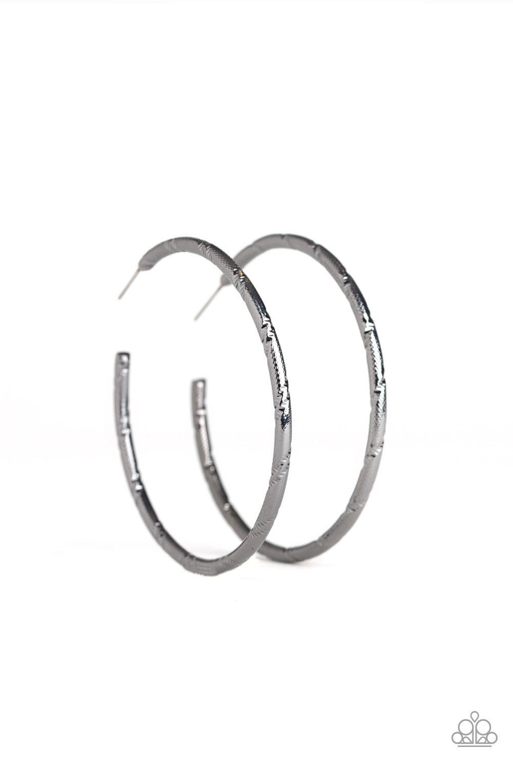 Paparazzi Accessories A Double Take - Black Etched in ribbons of diamond-cut shimmer, a shiny gunmetal hoop curls around the ear for a classic look. Earring attaches to a standard post fitting. Hoop measures 2 1/4" in diameter. Sold as one pair of hoop ea