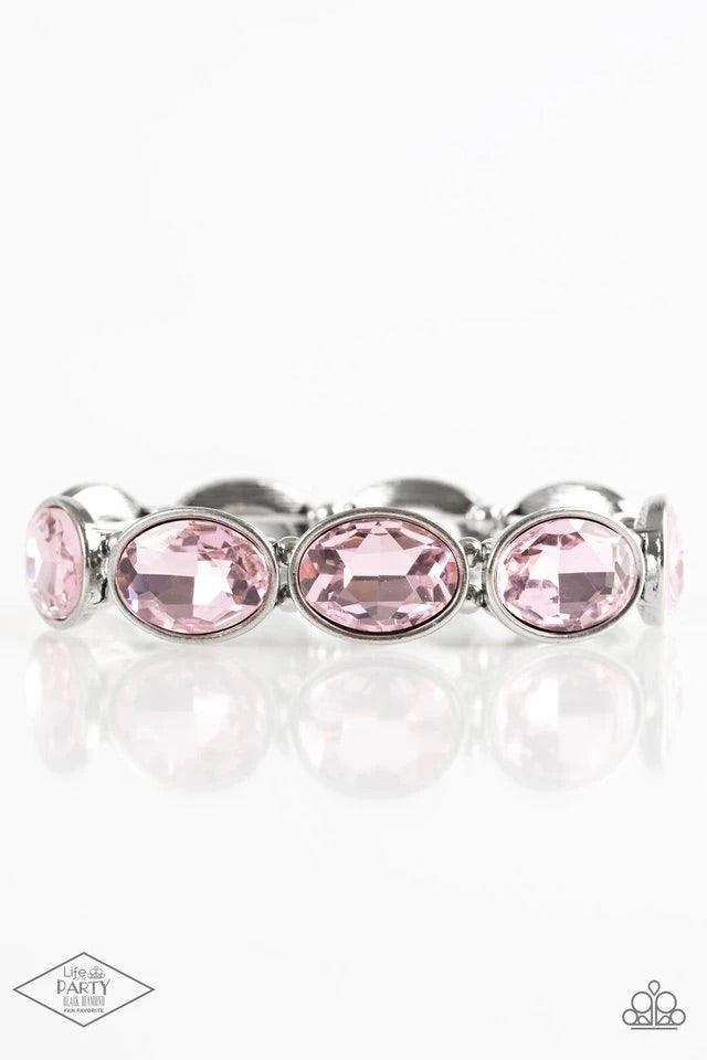 Paparazzi Accessories Diva in Disguise - Pink Glassy pink gems are pressed into sleek silver frames. Infused with dainty silver beads, the glittery frames are threaded along stretchy elastic bands for a glamorous look around the wrist. Sold as one individ